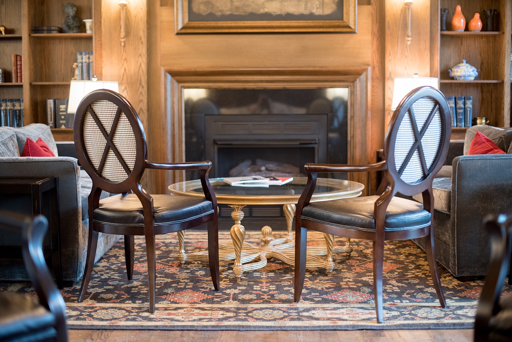 Mikkel Paige Photography, Raleigh wedding photographer, photos of The Mayton Inn hotel and venue in Cary, NC. Sitting room detail with upholstered chairs with black and white fabric houndstooth detail.