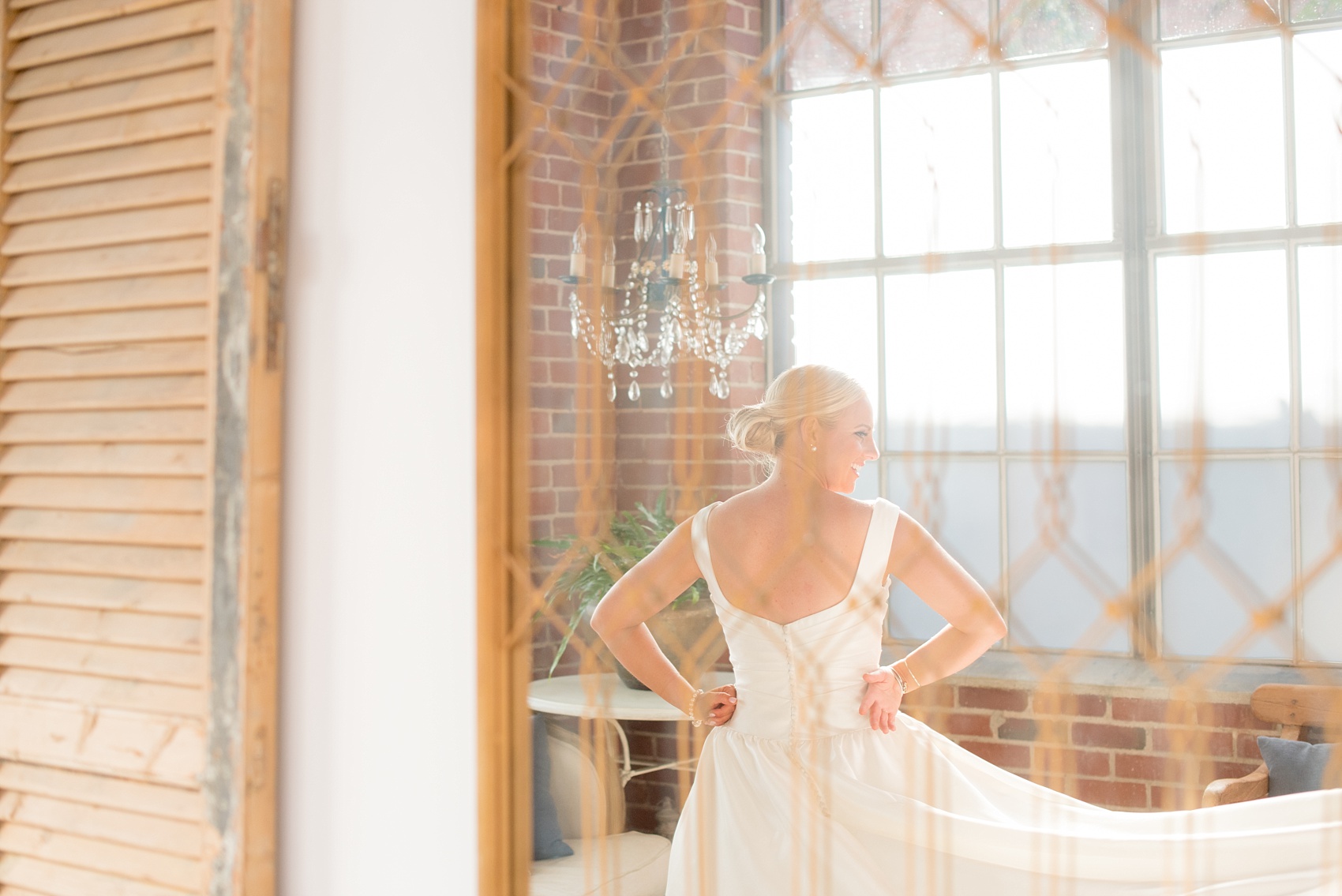 Mikkel Paige Photography photo of a wedding at The Rickhouse, Durham. The bride prepares in the bridal suite.