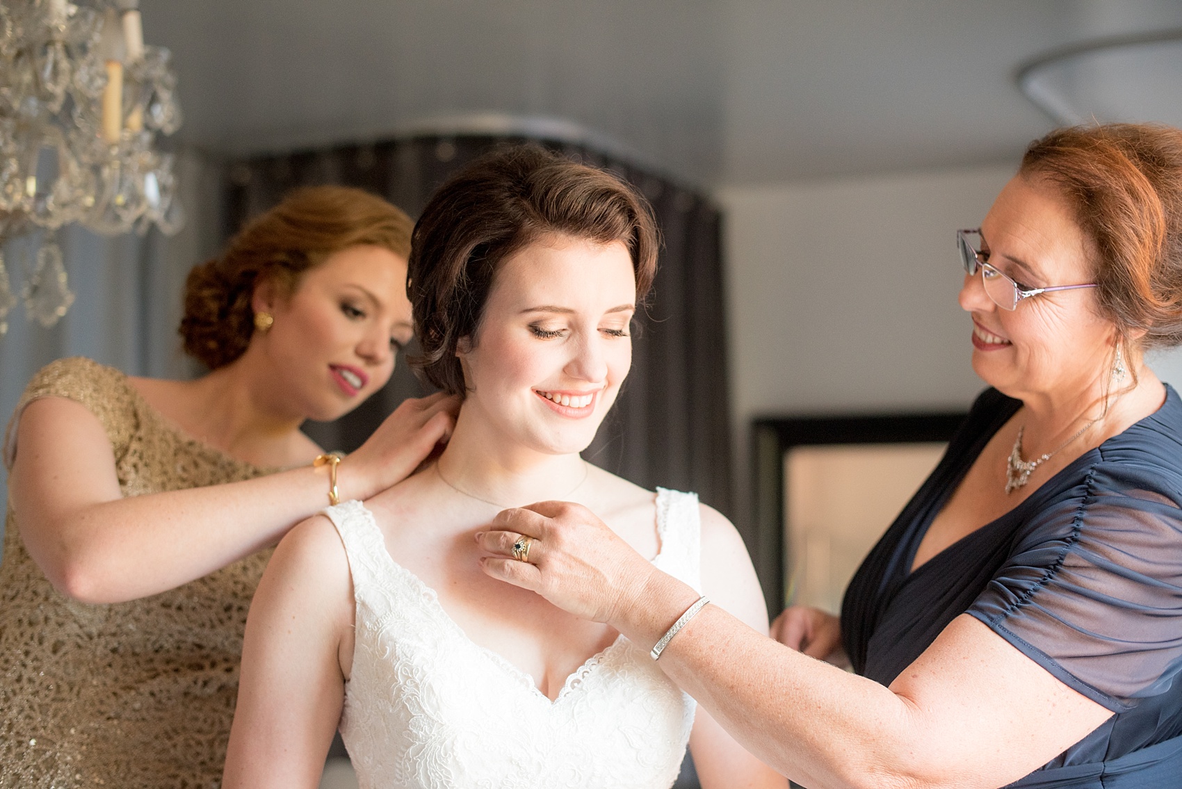 Mikkel Paige Photography photo of a bride getting ready in The White Room in downtown Raleigh for a North Carolina wedding.