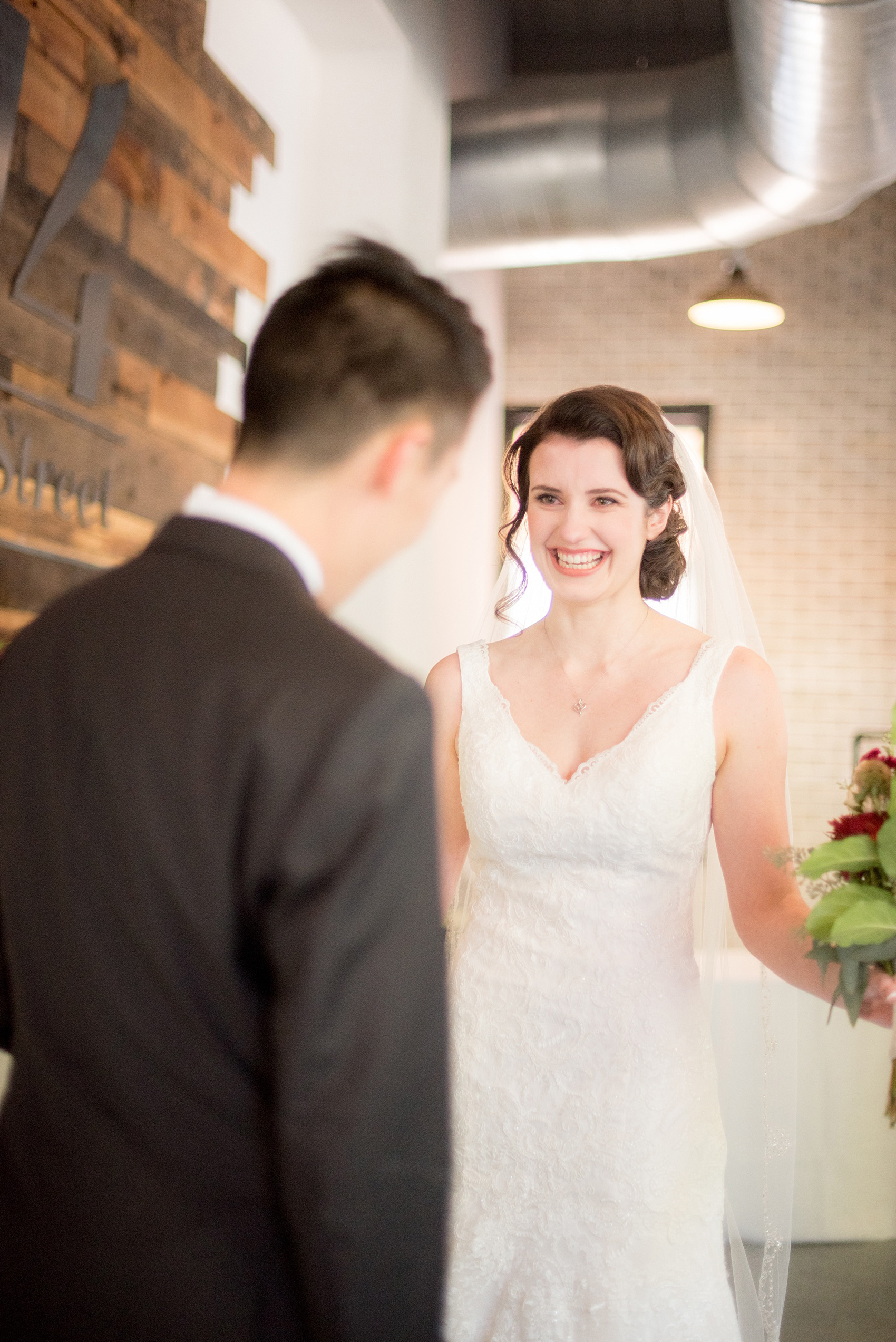 Mikkel Paige Photography photo of a 214 Martin Street downtown Raleigh wedding with the bride and groom's first look.