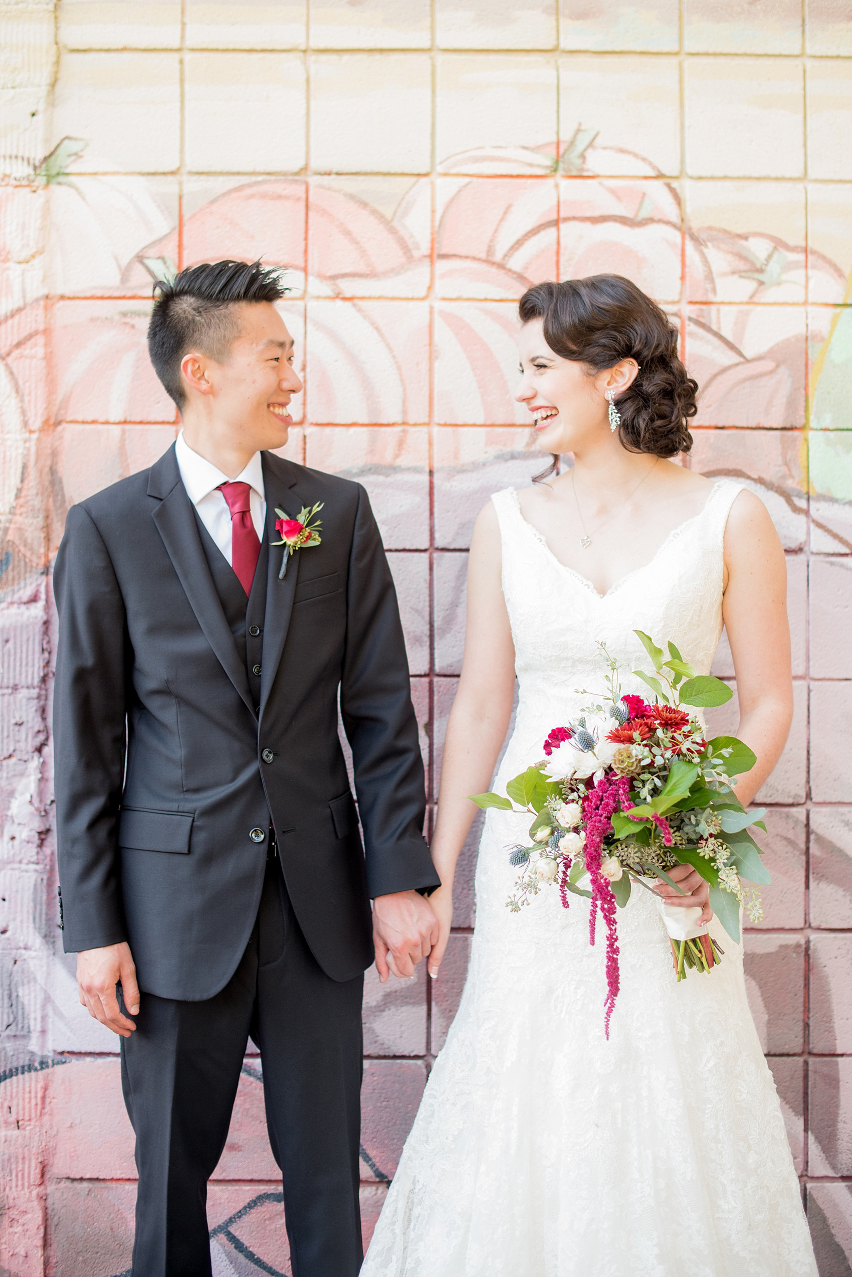 Mikkel Paige Photography photos of bride and groom and colorful mural in downtown Raleigh for a 214 Martin Street.