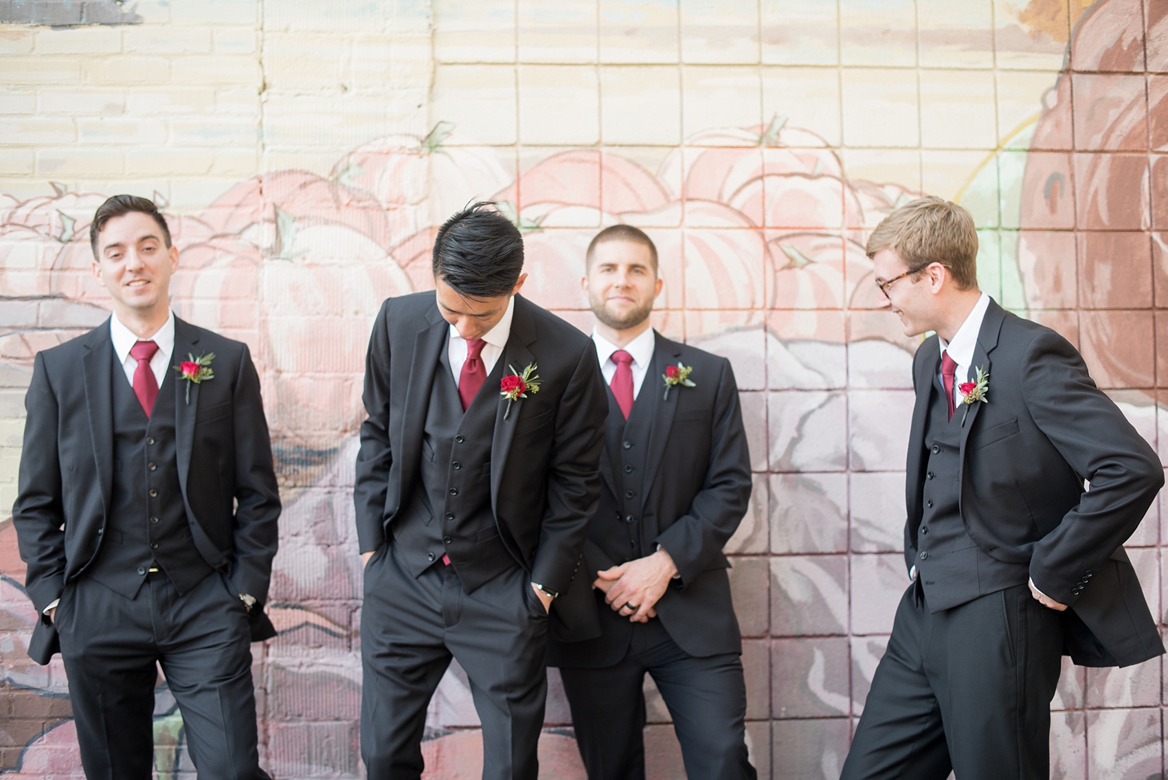 Mikkel Paige Photography photos of groomsmen and a colorful mural in downtown Raleigh for a 214 Martin Street wedding.