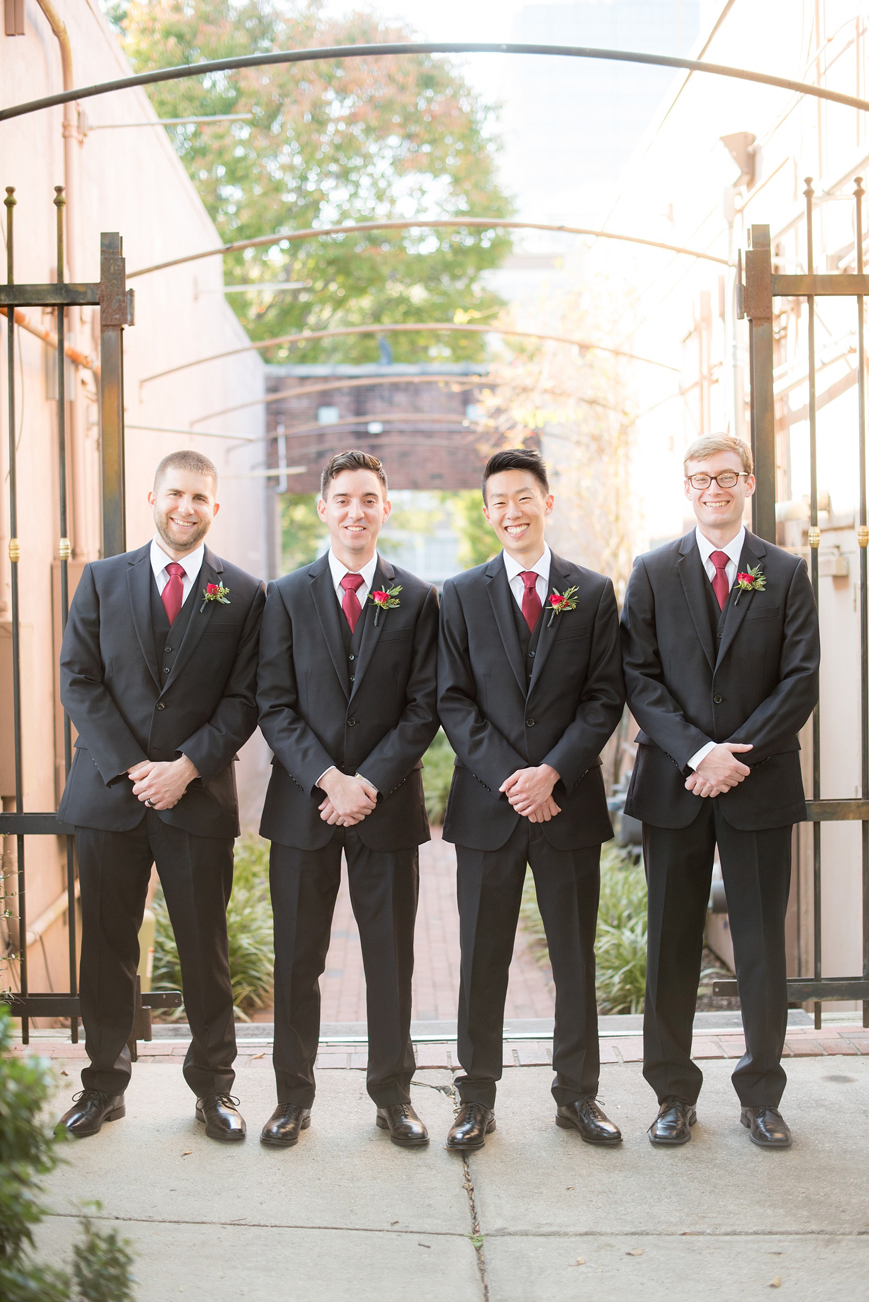 Mikkel Paige Photography photos of a groom and his groomsmen in downtown Raleigh for a 214 Martin Street wedding.