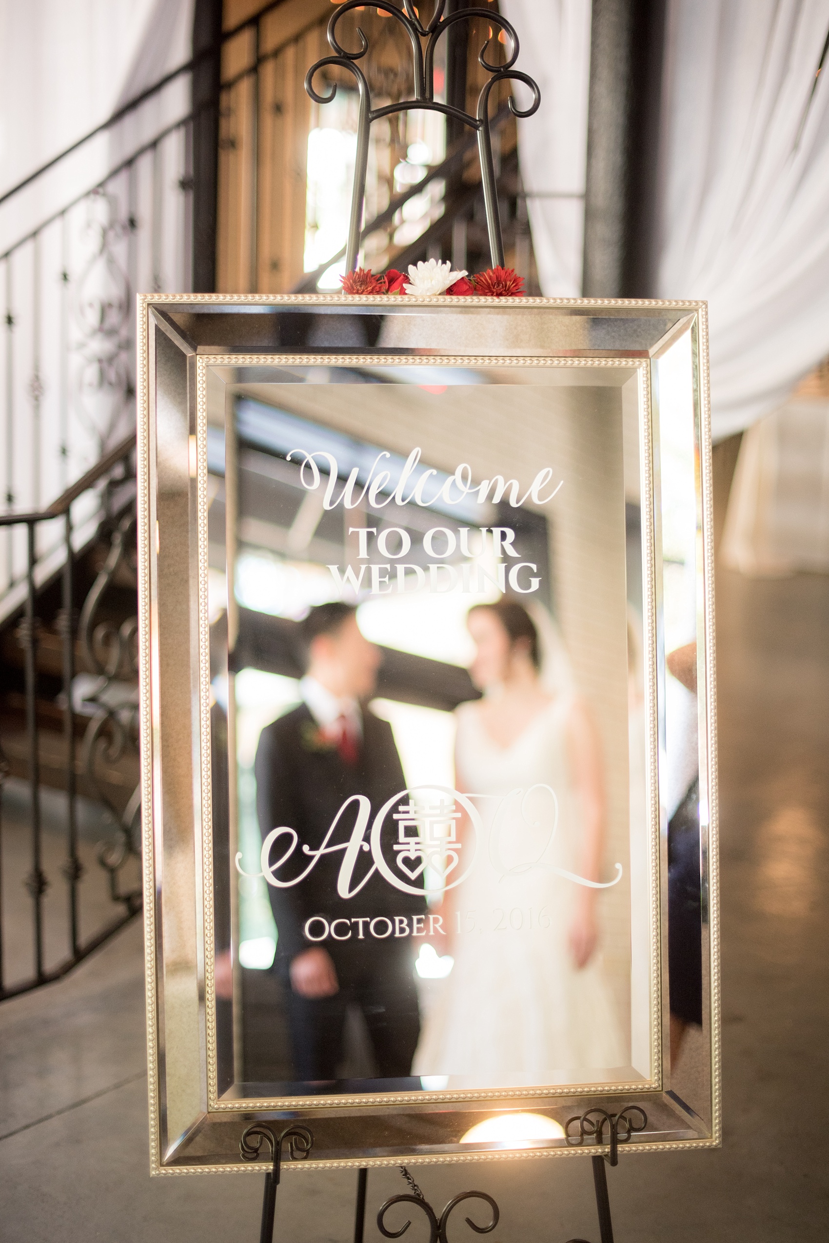 Mikkel Paige Photography photos from a wedding at 214 Martin Street in downtown Raleigh with a custom mirror sign.