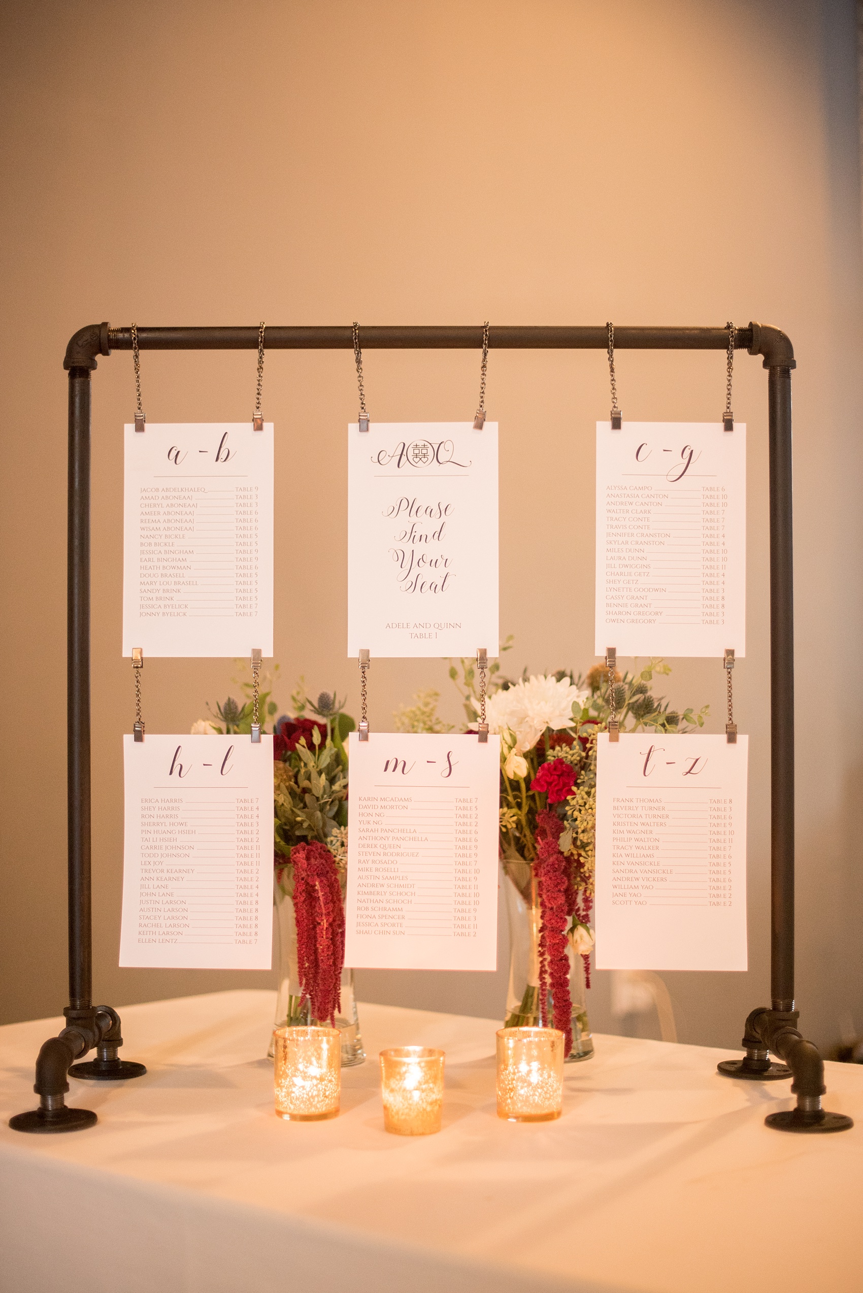 Mikkel Paige Photography photos from a wedding at 214 Martin Street in downtown Raleigh with a unique escort card detail sign.