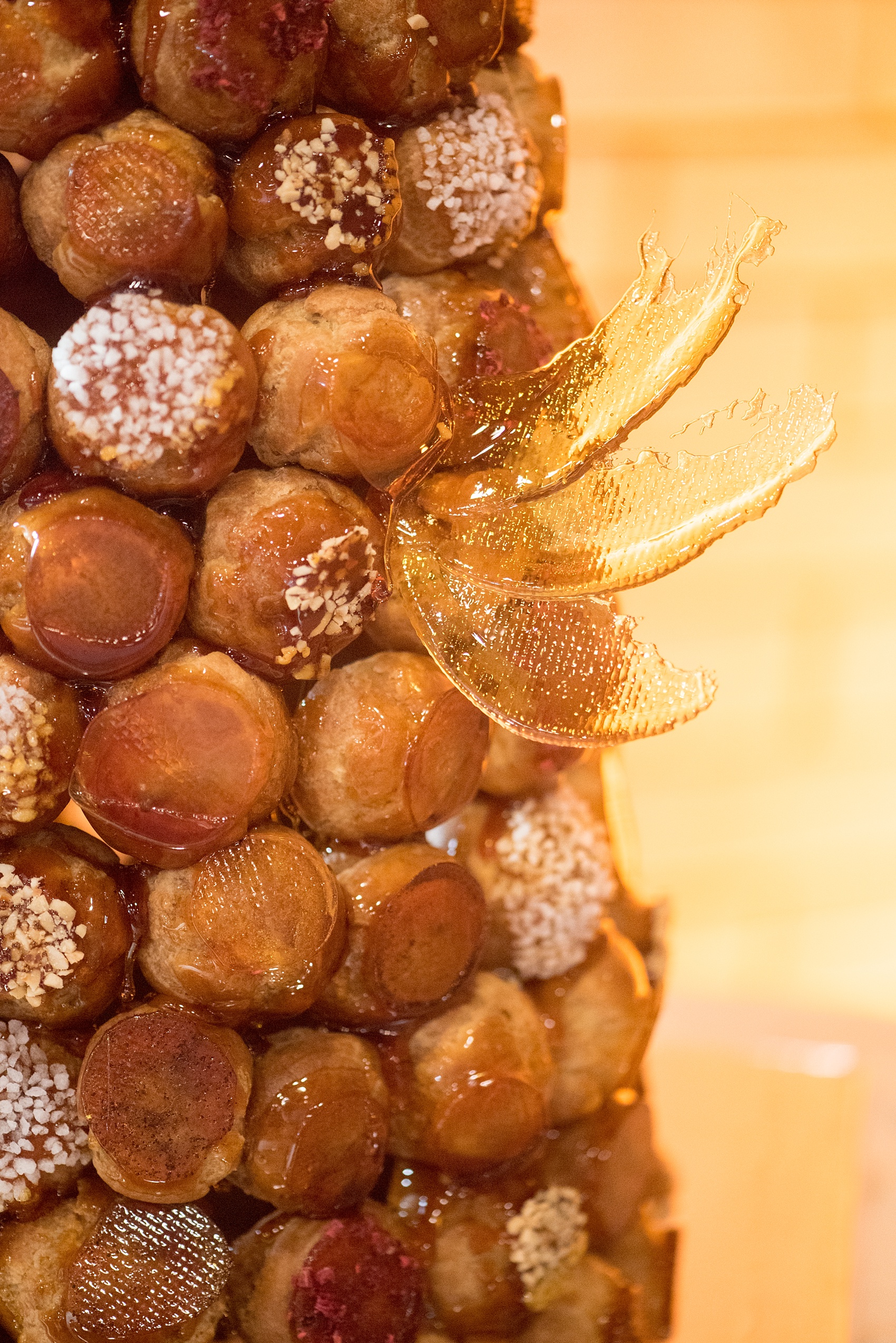 Mikkel Paige Photography photos from a wedding at 214 Martin Street in downtown Raleigh. Dessert table with a traditional french Croquembouche by LucetteGrace.