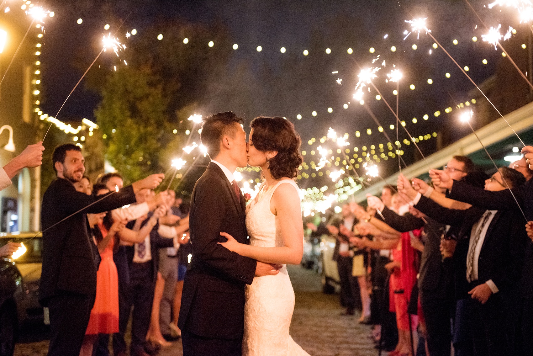 Mikkel Paige Photography photos from a wedding at 214 Martin Street in downtown Raleigh. Picture of the bride and groom during their sparkler exit.