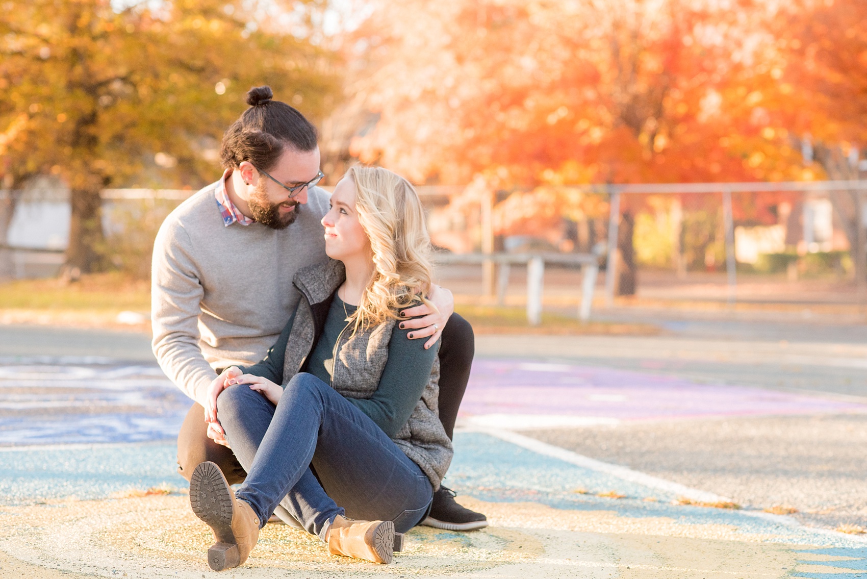 Mikkel Paige Photography photos of a Durham engagement session with colorful parking spaces and fall leaves.