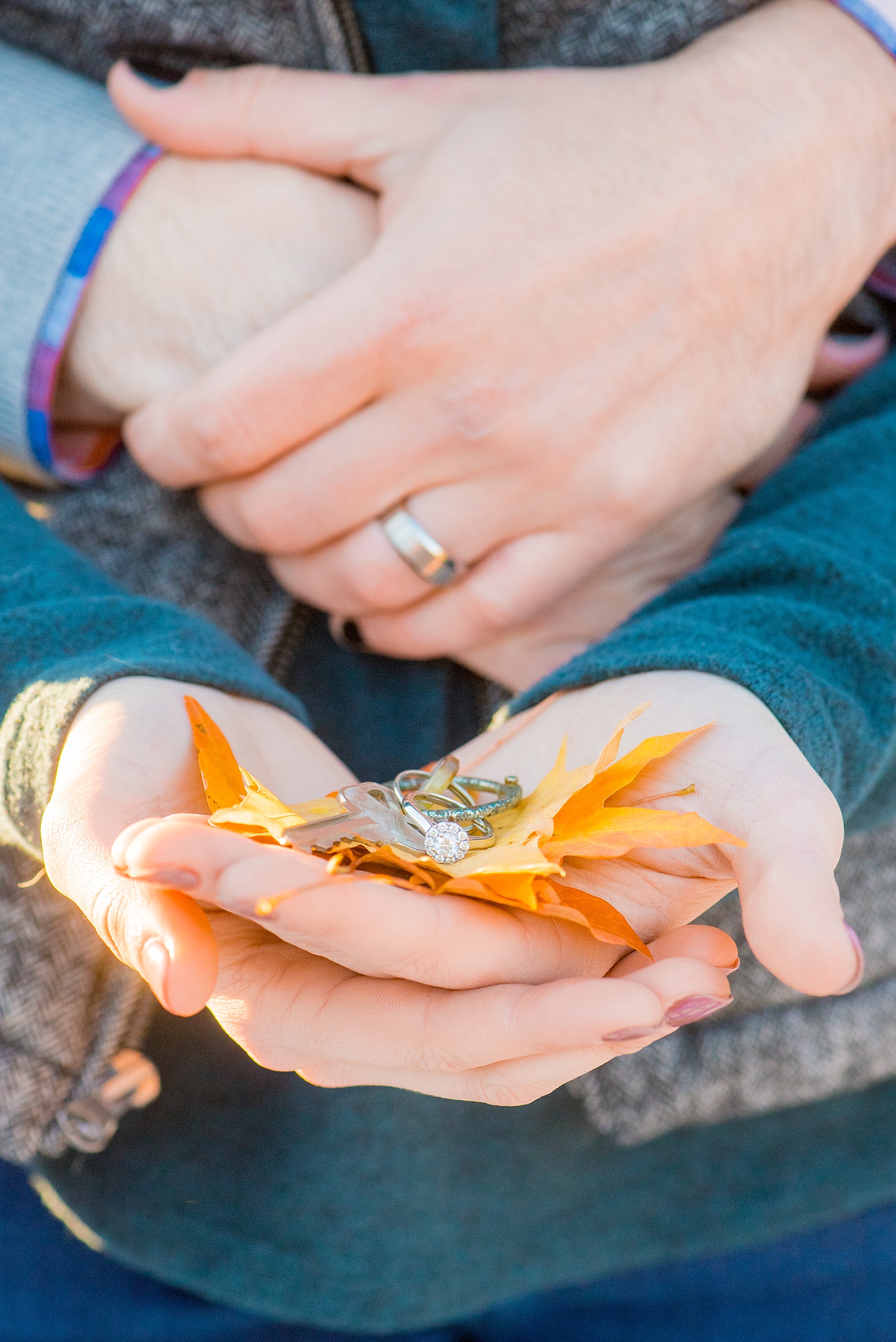 Mikkel Paige Photography photos of a downtown Durham engagement session with a detail engagement ring photo on fall leaves.