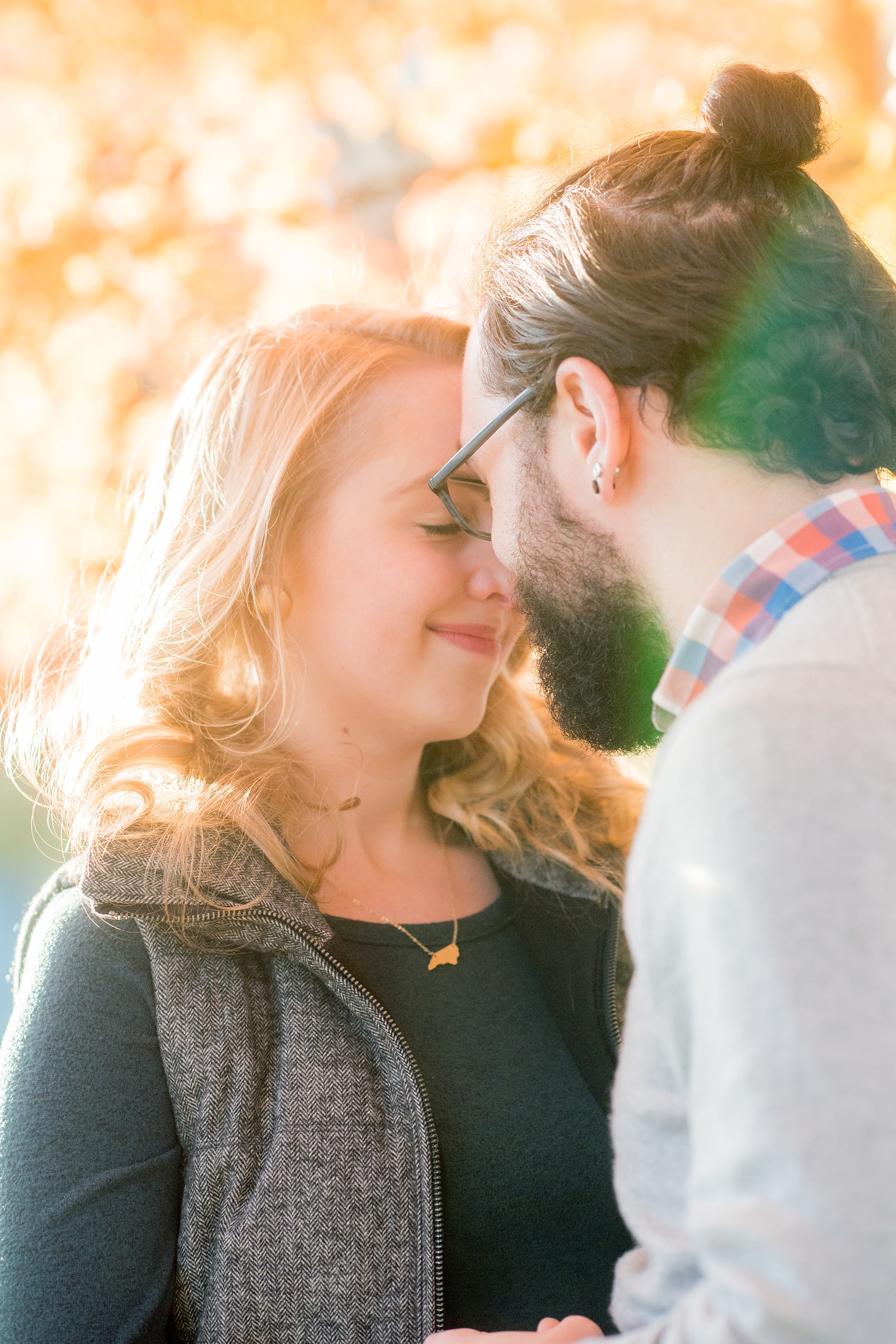 Mikkel Paige Photography photos of a downtown Durham engagement session with a fall leaves and cozy outfits.