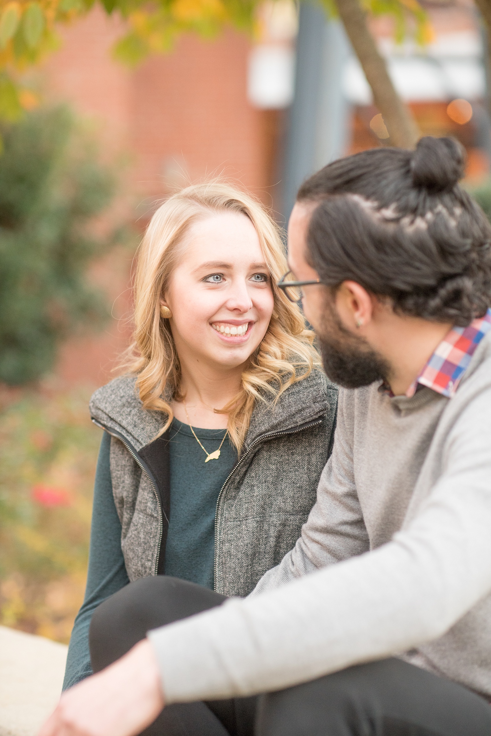 Mikkel Paige Photography photos of a Durham engagement session at American Tobacco Campus with fall leaves.