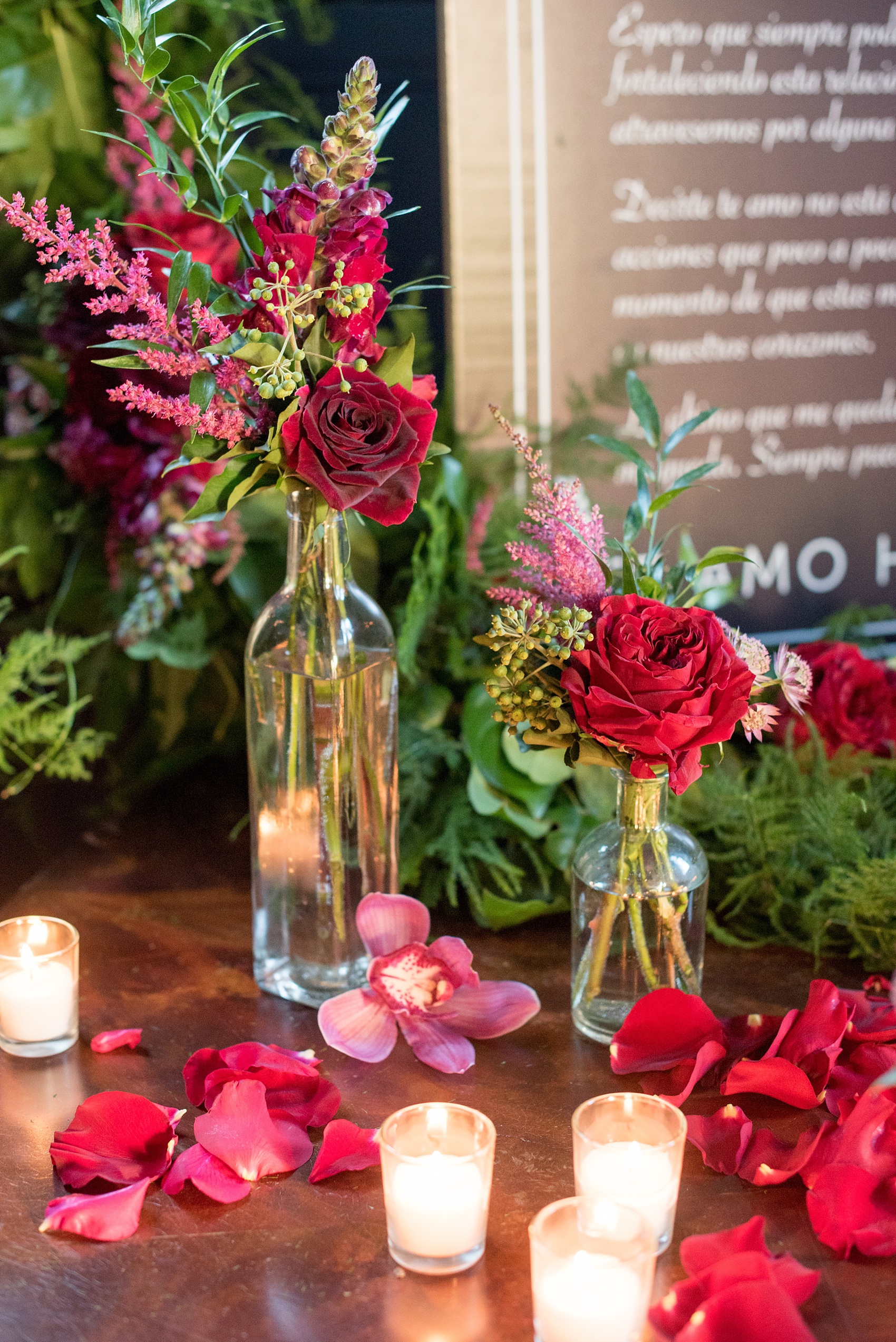 Mikkel Paige Photography photos of a NYC proposal at The Nomad Hotel. The Arrangement presented gorgeous red and pink flowers for a romantic candlelight proposal planned by Brilliant Event Planning.