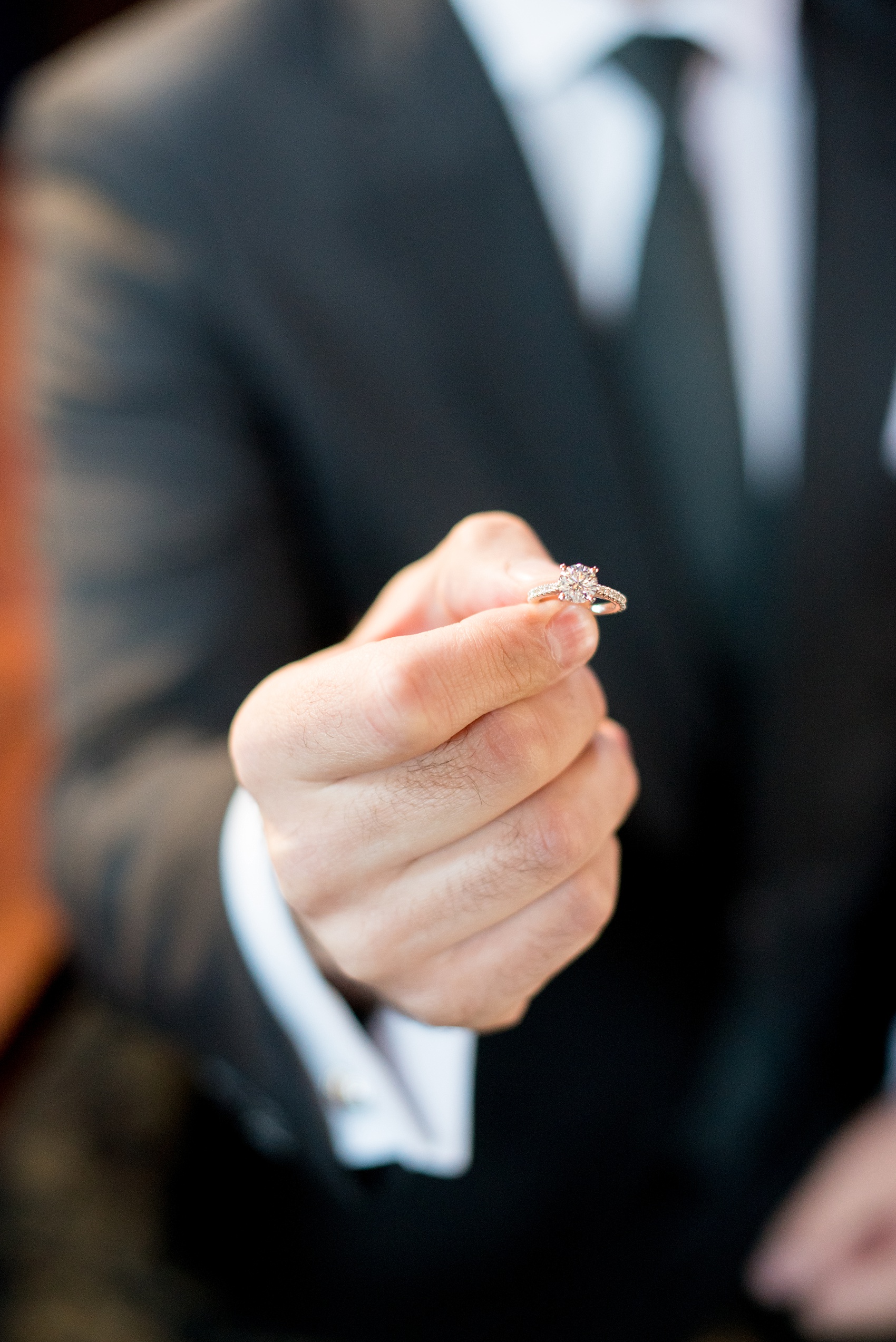 Mikkel Paige Photography photos of a NYC proposal at The Nomad Hotel. The diamond round eternity band ring was presented with vintage perfume bottles. 