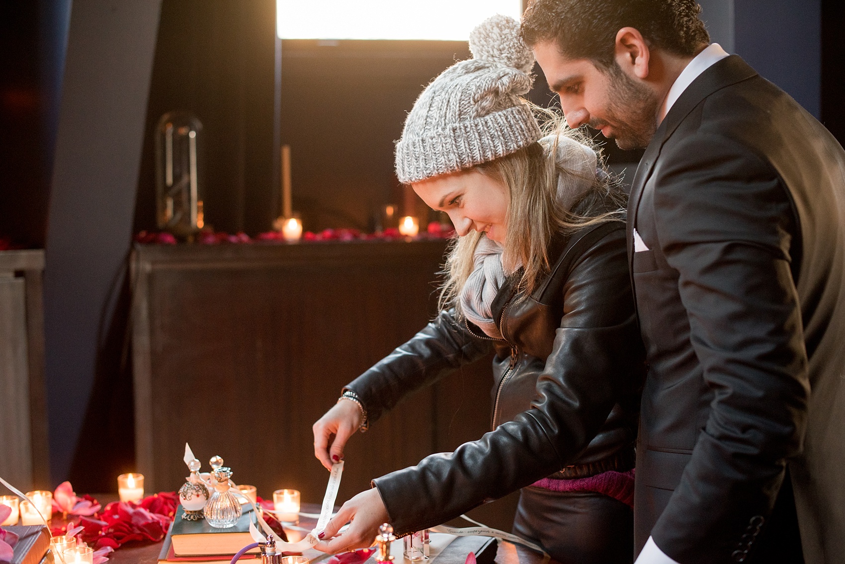 Mikkel Paige Photography photos of a surprise romantic NYC proposal at The Nomad Hotel. A special detail was hand calligraphy on ribbons attached to vintage perfume bottles with unique messages to the bride from her new groom.