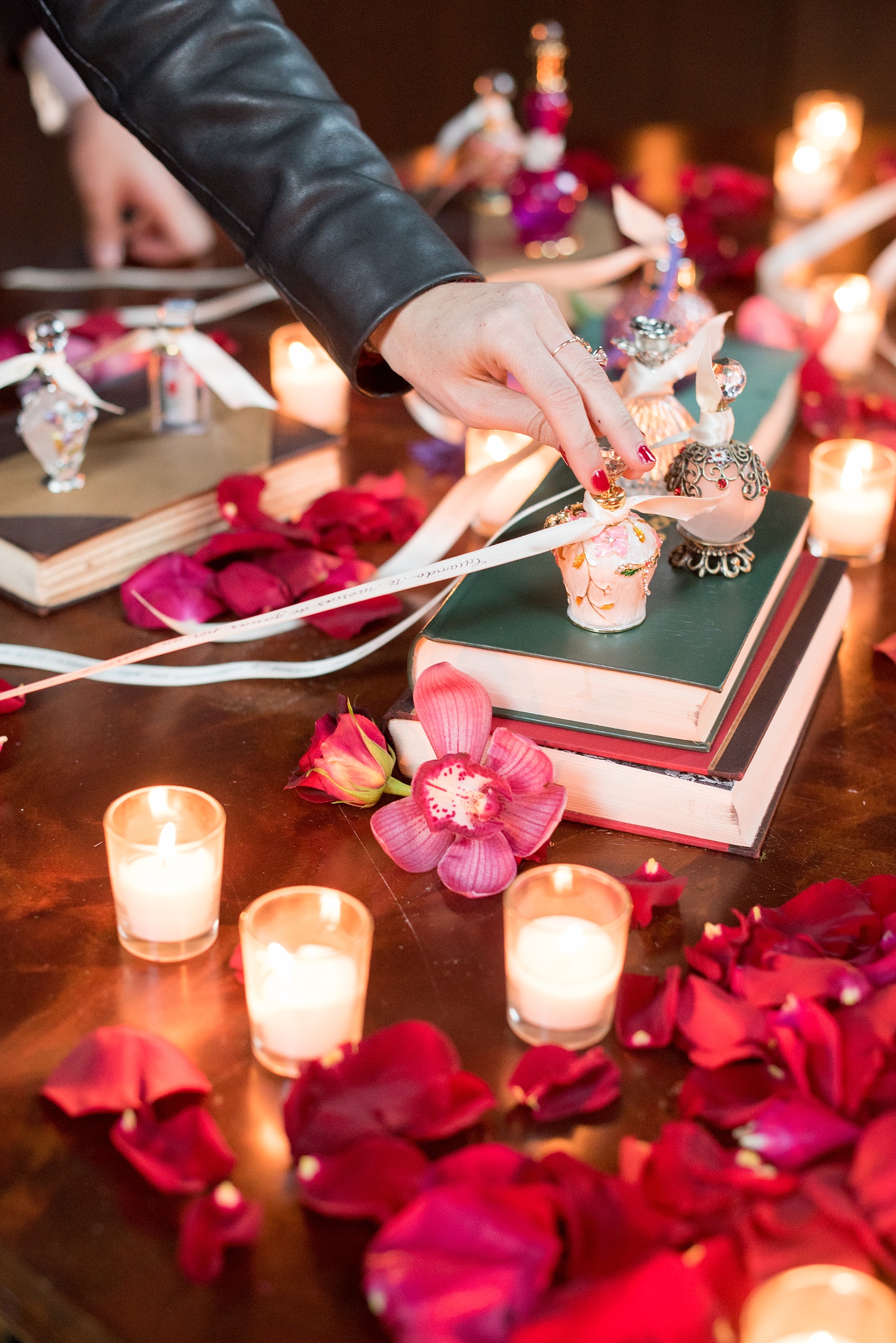 Mikkel Paige Photography photos of a NYC proposal at The Nomad Hotel. The Arrangement presented gorgeous red and pink flowers for a romantic candlelight proposal planned by Brilliant Event Planning.