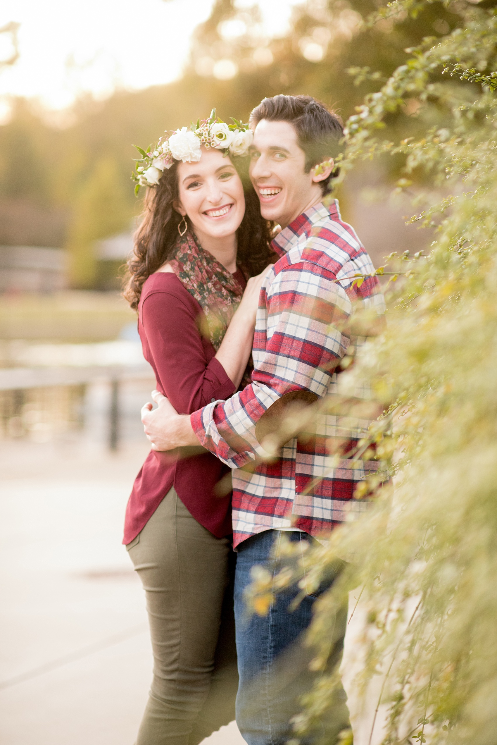 Mikkel Paige Photography images of a Raleigh engagement session at Pullen Park with a white floral crown.