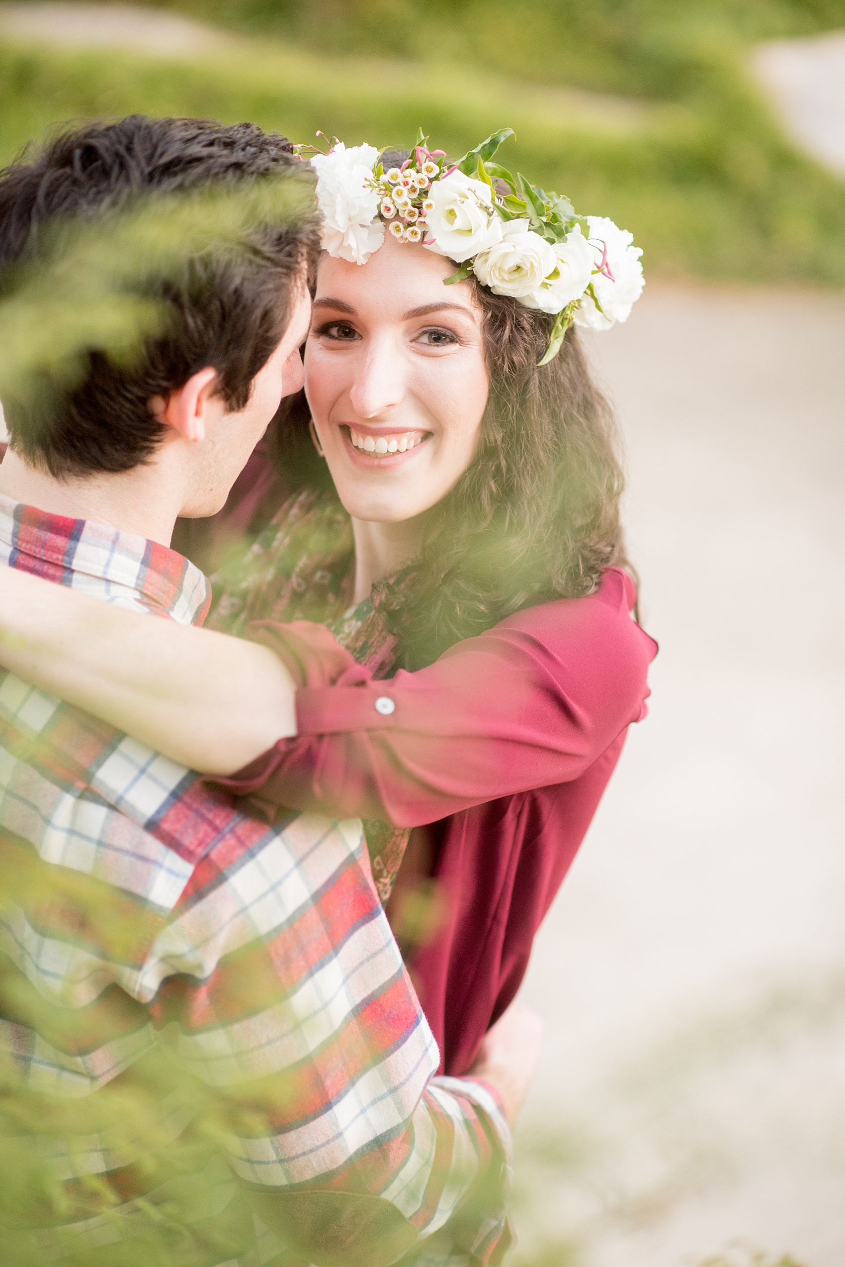 Mikkel Paige Photography images of a Raleigh engagement session at Pullen Park with a white floral crown.
