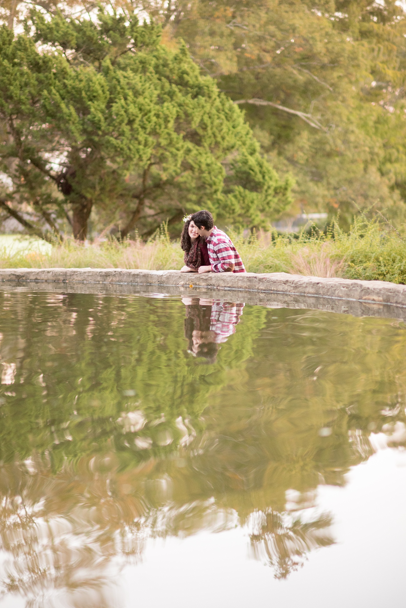 Mikkel Paige Photography photos of an autumn Raleigh engagement session at Pullen Park with a white floral crown.