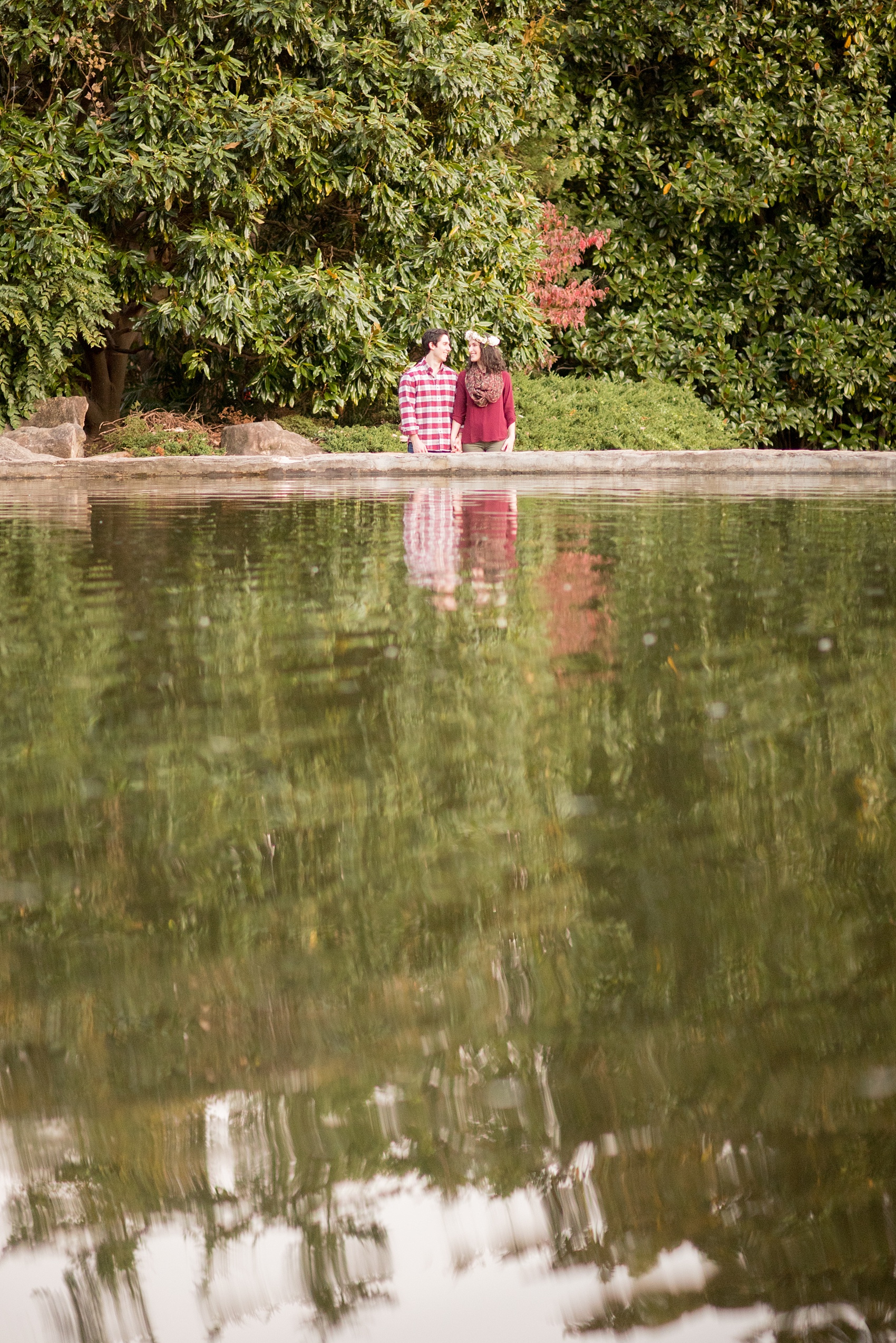 Mikkel Paige Photography photos of an autumn Raleigh engagement session at Pullen Park with a white floral crown.