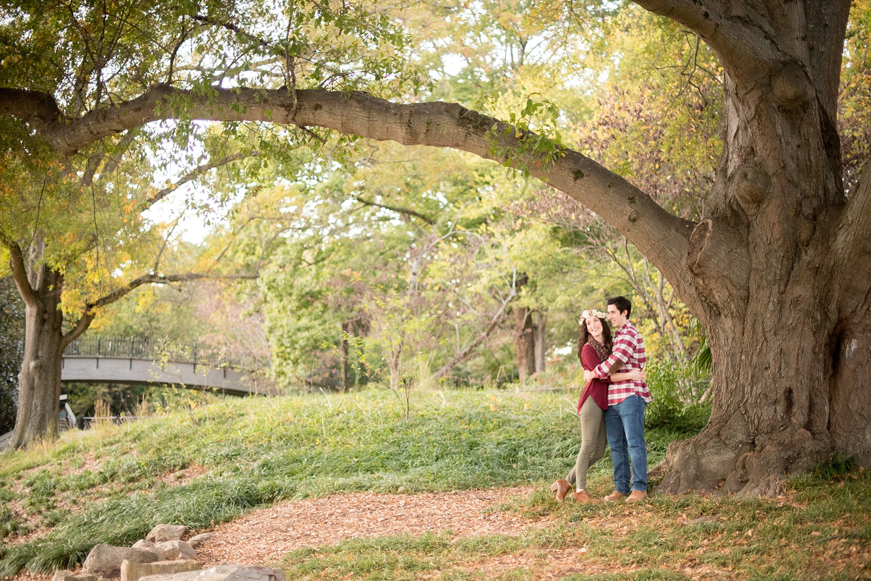 Mikkel Paige Photography photos of a fall downtown Raleigh engagement session at Pullen Park with a white floral crown.