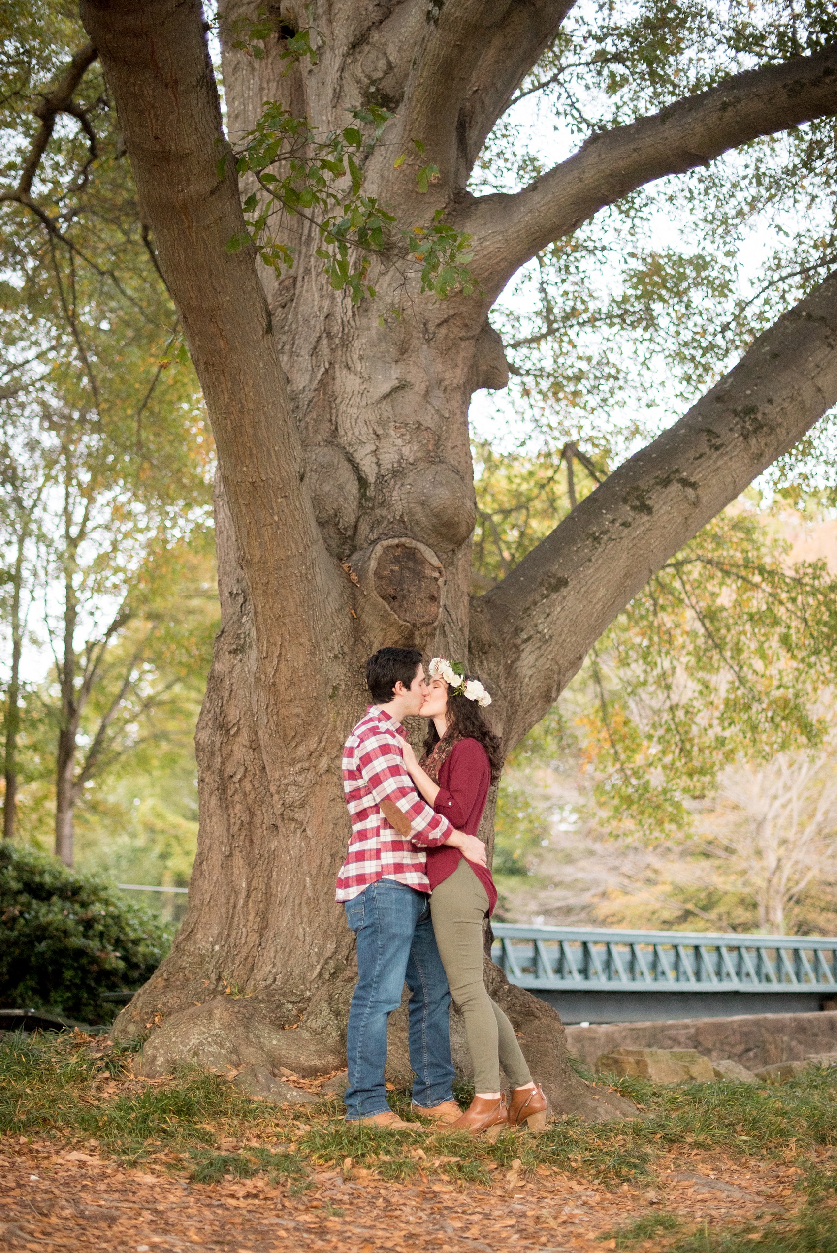 Mikkel Paige Photography photos of a fall downtown Raleigh engagement session at Pullen Park with a white floral crown.