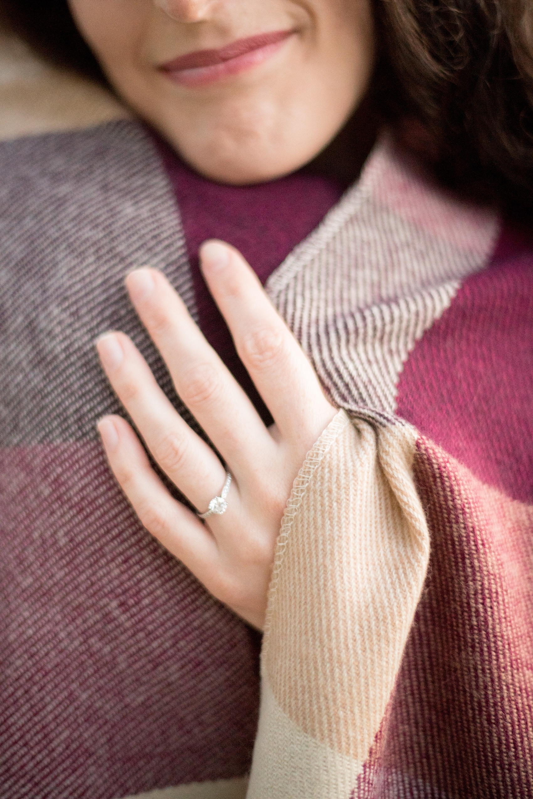 Mikkel Paige Photography photos of a Raleigh engagement session at Pullen Park. The bride and groom got cozy in a burgundy plaid blanket.