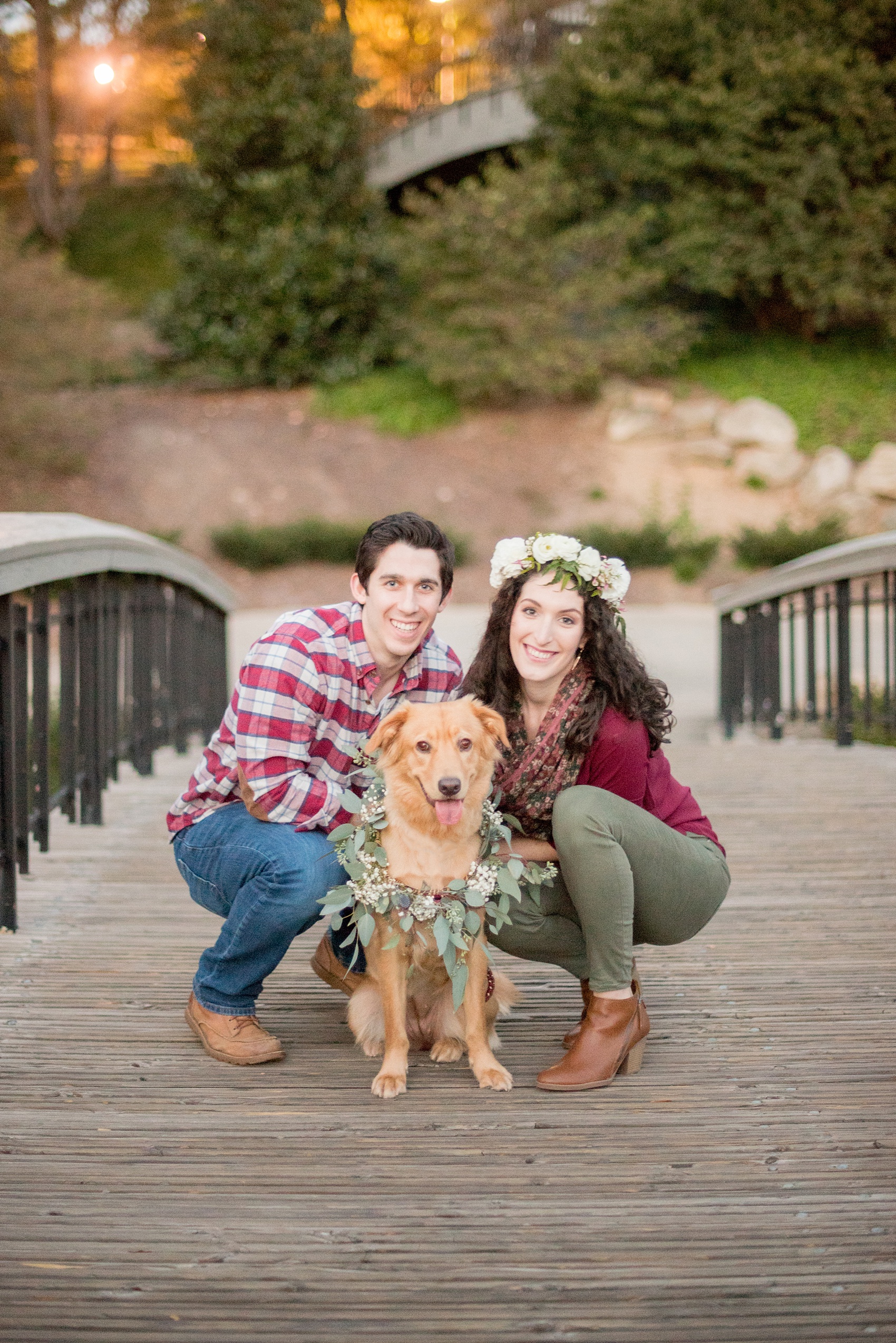 Mikkel Paige Photography photos of a Raleigh engagement session at Pullen Park with the couple's rescue dog in a eucalyptus collar.