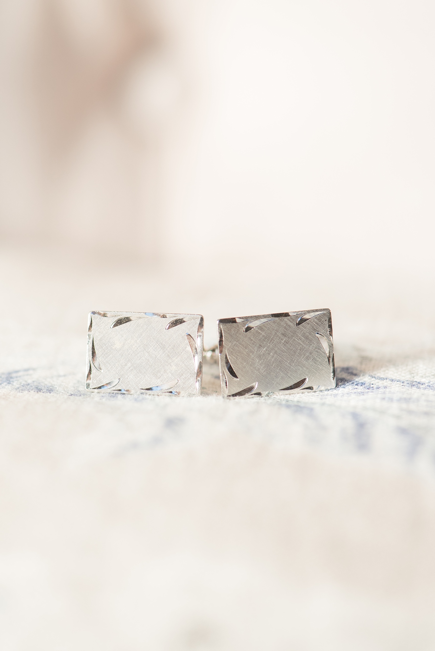 Mikkel Paige Photography photo of a wedding at The Rickhouse, Durham. The groom had special silver rectangular cufflinks.