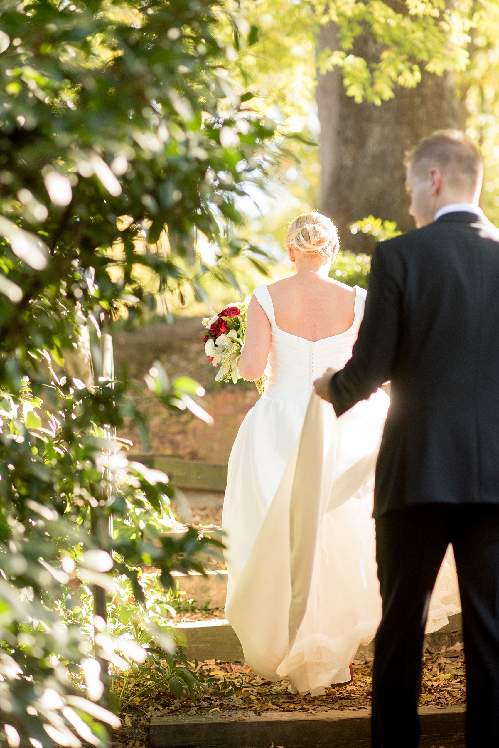 Mikkel Paige Photography photo of a wedding at The Rickhouse, North Carolina. Pictures of the bride and groom after their first look in Durham Central Park.