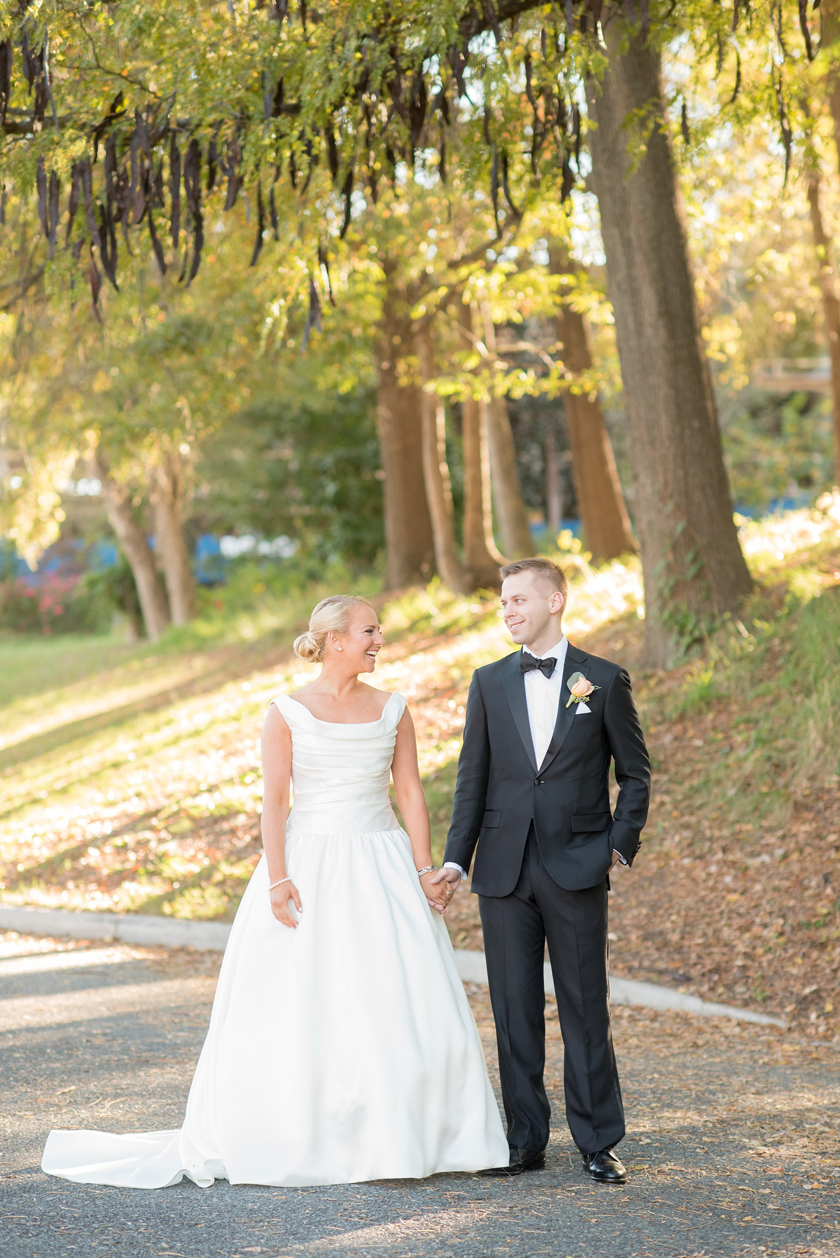 Mikkel Paige Photography photo of a wedding at The Rickhouse, North Carolina. The bride and groom kiss in Durham Central Park after their first look!