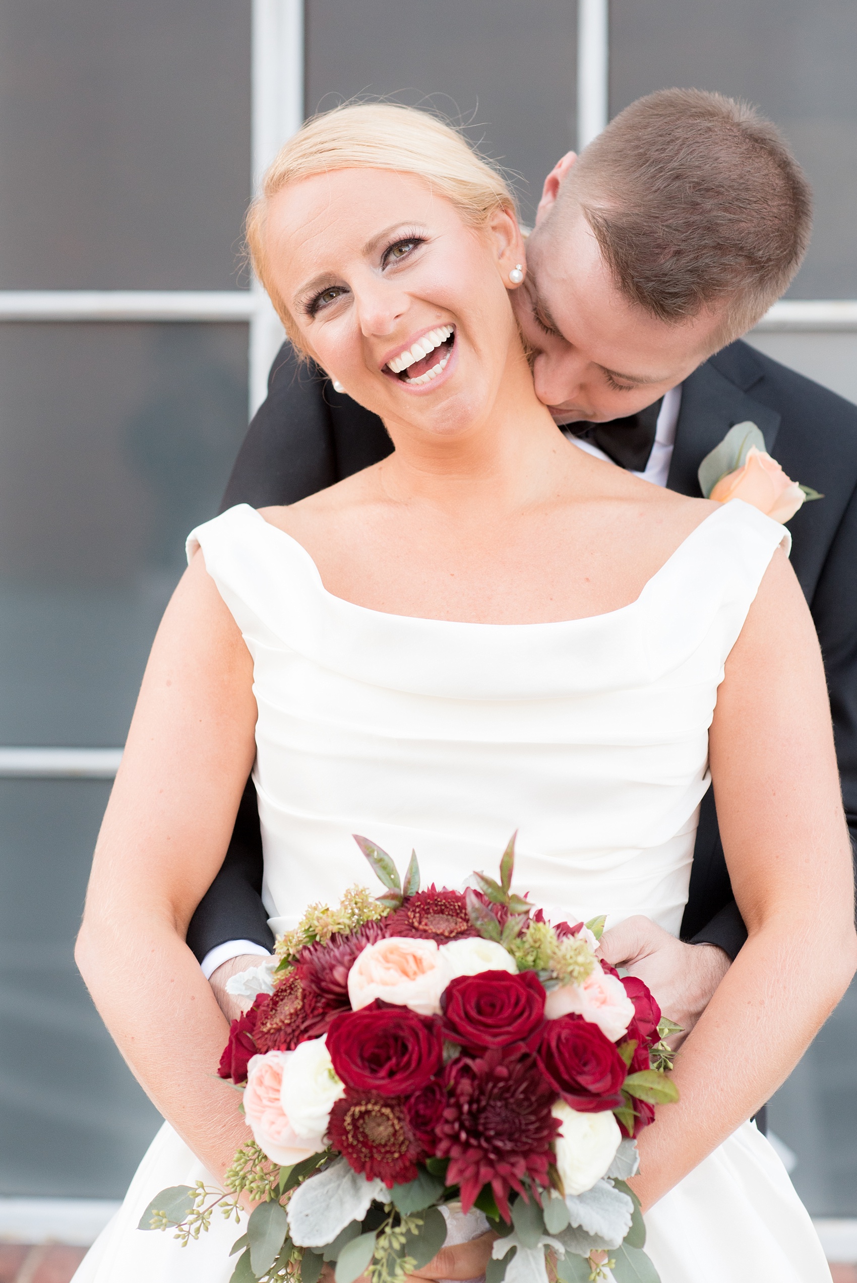 Mikkel Paige Photography photo of a wedding at The Rickhouse, Durham. The bride wore a scoop neck gown and carried an antique fall bouquet.