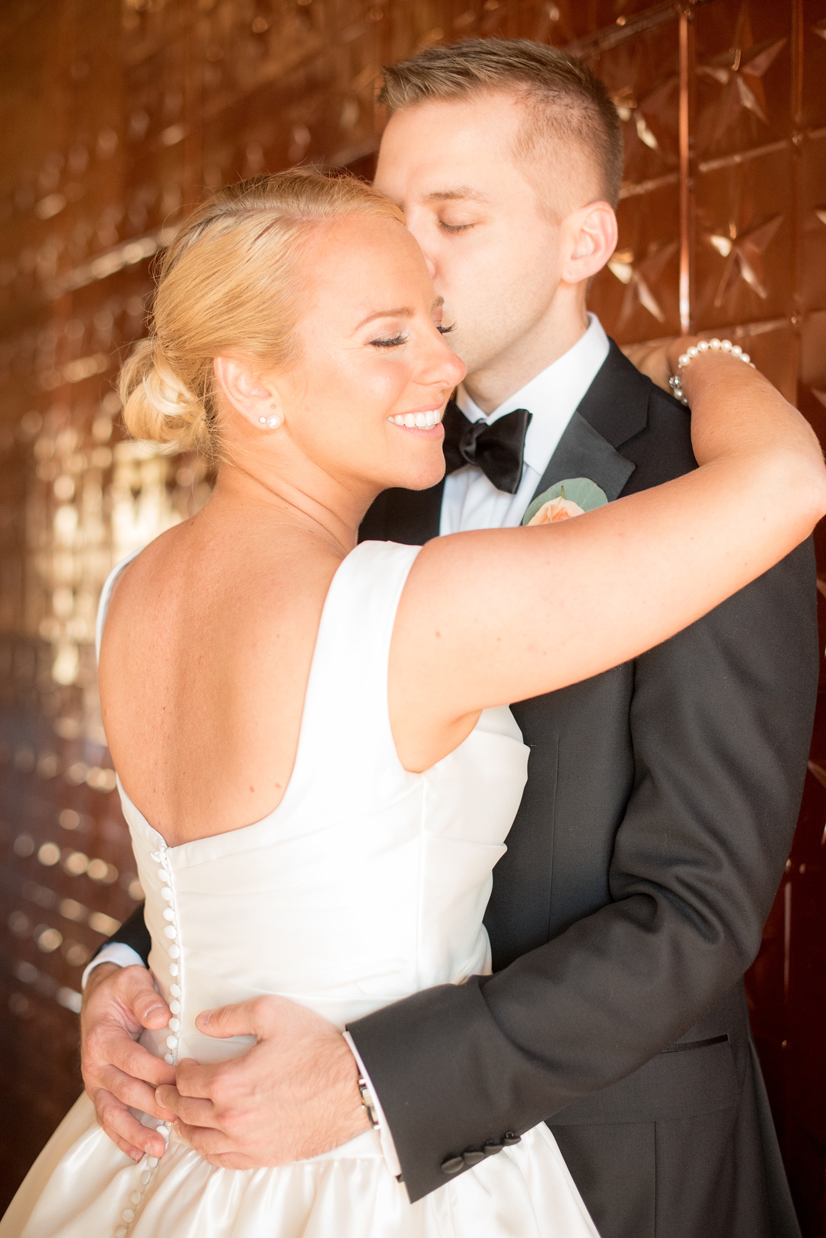 The Rickhouse copper star wall wedding photo by Mikkel Paige Photography. Unique, iconic image of the bride and groom in the Durham, NC venue.