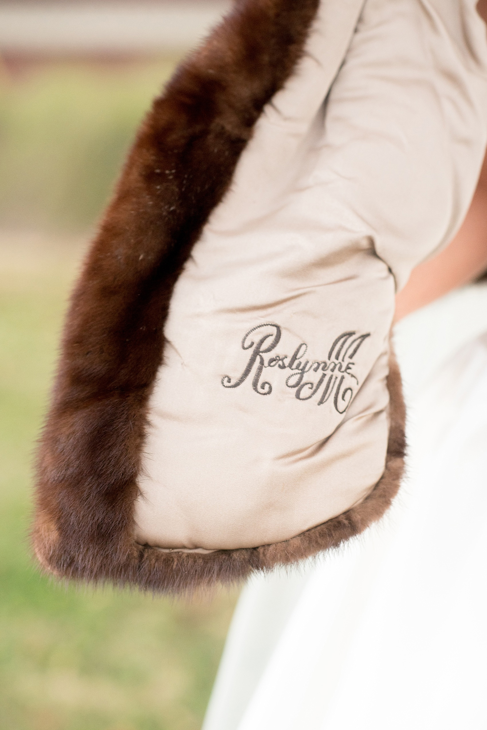 Mikkel Paige Photography photo of a wedding at The Rickhouse, NC. A picture of bride's heirloom fur stahl with her grandmother's name embroidered in it.