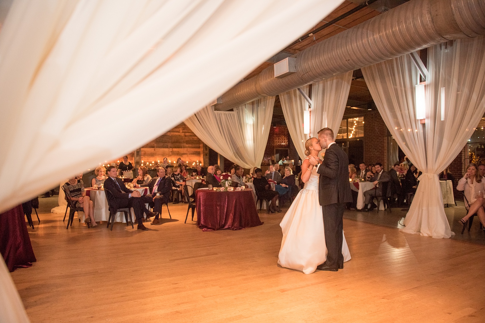 Mikkel Paige Photography photo of a wedding at The Rickhouse, NC. A picture of the bride and groom during their romantic first dance.