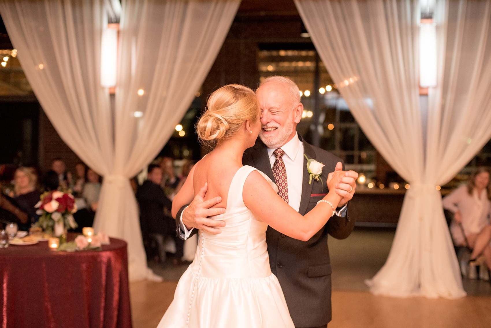 Mikkel Paige Photography photo of a wedding at The Rickhouse, NC. A picture of the bride dancing with her father.