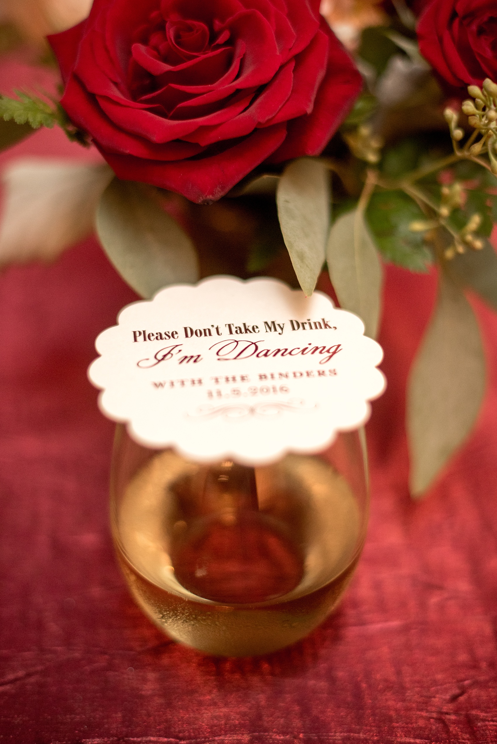 Mikkel Paige Photography photo of a wedding at The Rickhouse, NC. A picture of custom coasters with "Don't Take My Drink...I'm Dancing..."