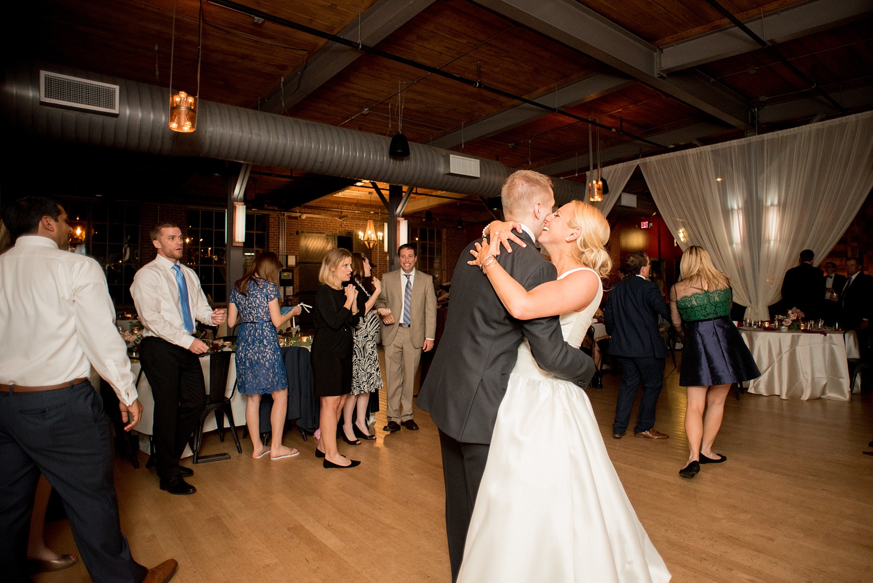 Mikkel Paige Photography photo of a wedding at The Rickhouse, NC. A picture of bride and groom dancing during their reception.