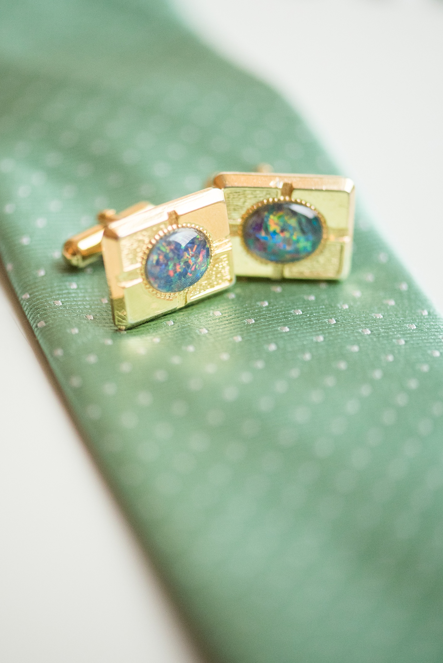 Mikkel Paige Photography photos of a wedding in downtown Chicago at The Rookery. The groom wore heirloom opal and gold rectangle cufflinks. 