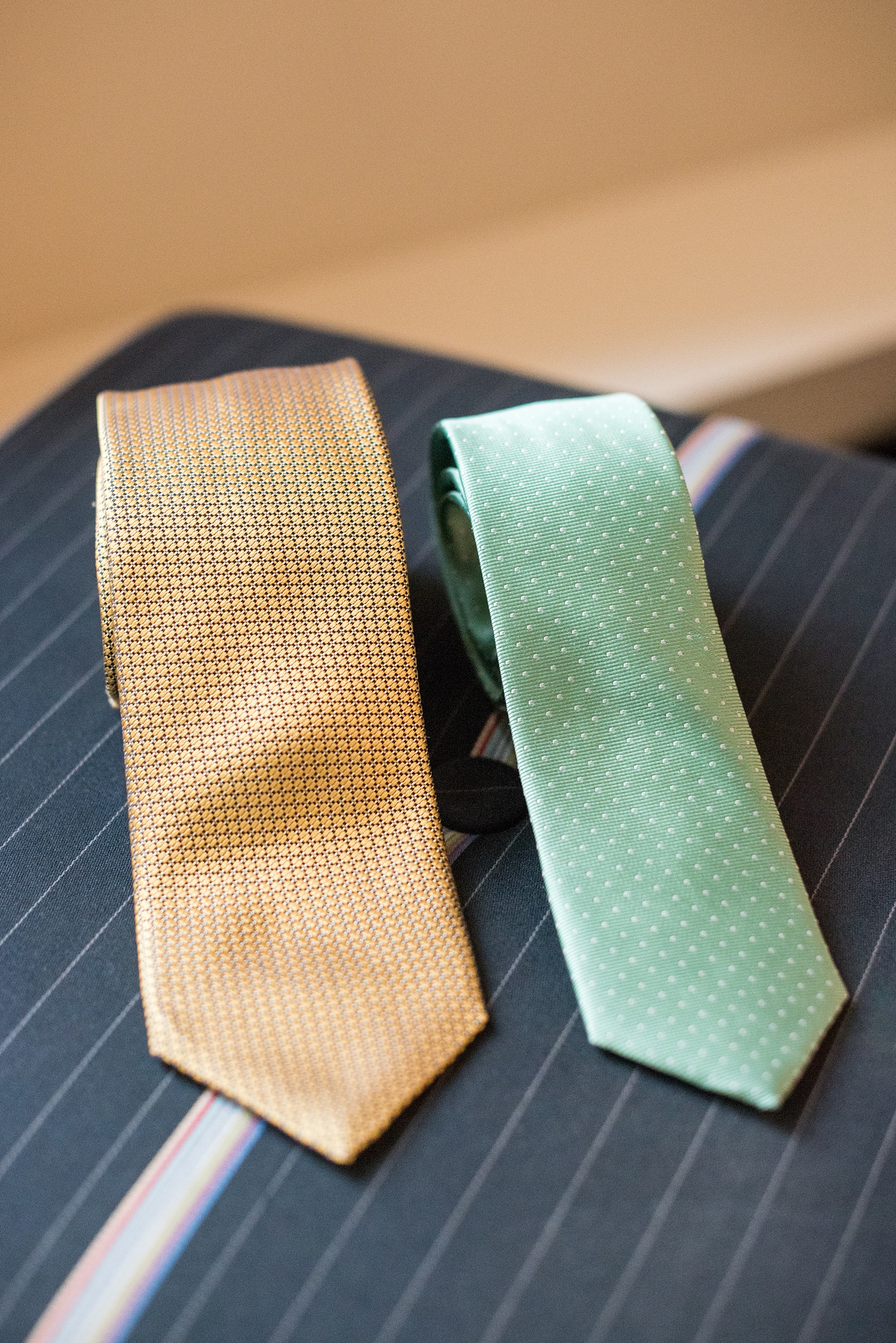 Mikkel Paige Photography photos of a wedding in downtown Chicago at The Rookery. The groom wore a yellow tie from The Tie Bar and groomsmen mint green and white polka dotted accessories. 