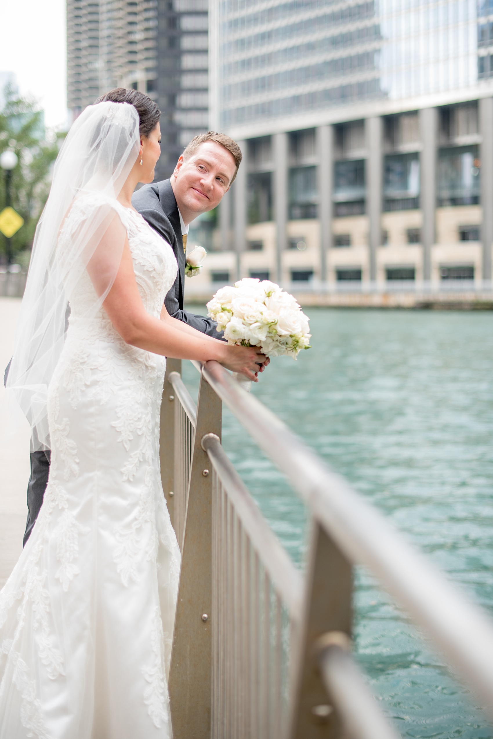 Mikkel Paige Photography photos of a wedding in downtown Chicago at The Rookery. The bride and groom took photos by the waterfront and Riverwalk.