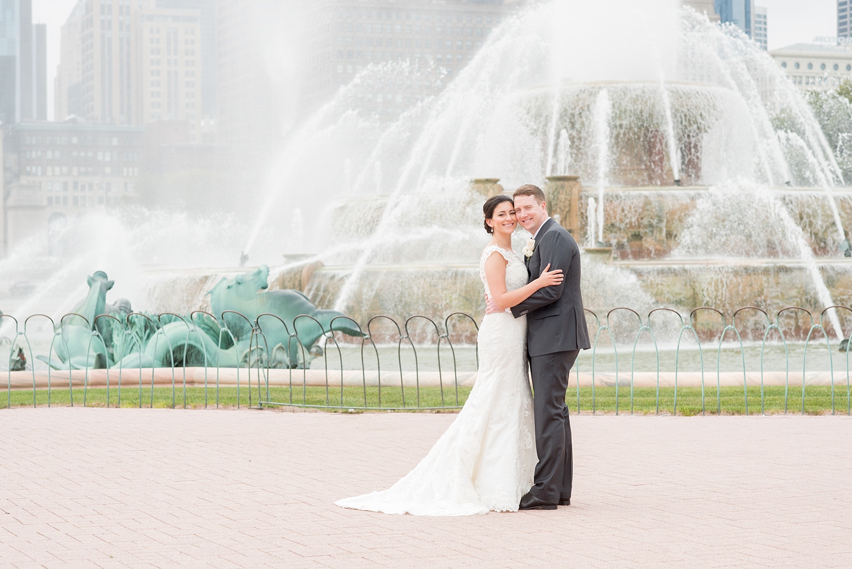 Mikkel Paige Photography photos of a wedding in downtown Chicago at The Rookery, with the bride and groom by Buckingham Fountain.