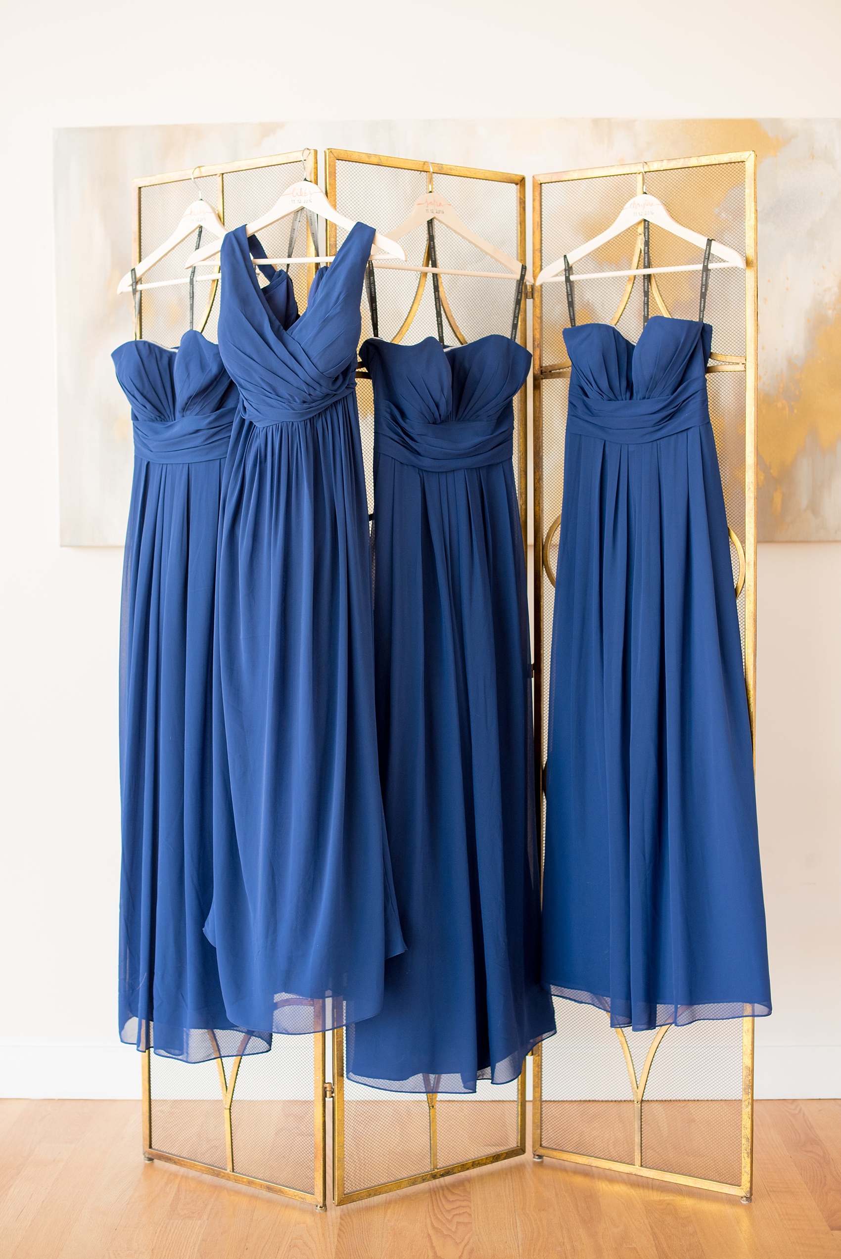 Mikkel Paige Photography photos from a wedding at The Glass Box and Stockroom at 230 in Raleigh. The bridesmaids wore cobalt blue Bill Levkoff gowns.