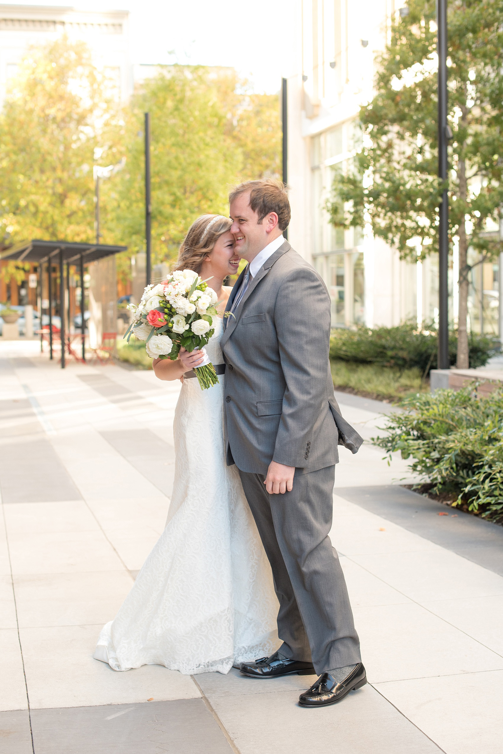 Mikkel Paige Photography photos from a wedding at The Stockroom at 230. A picture of the bride and groom in downtown Raleigh for their first look.