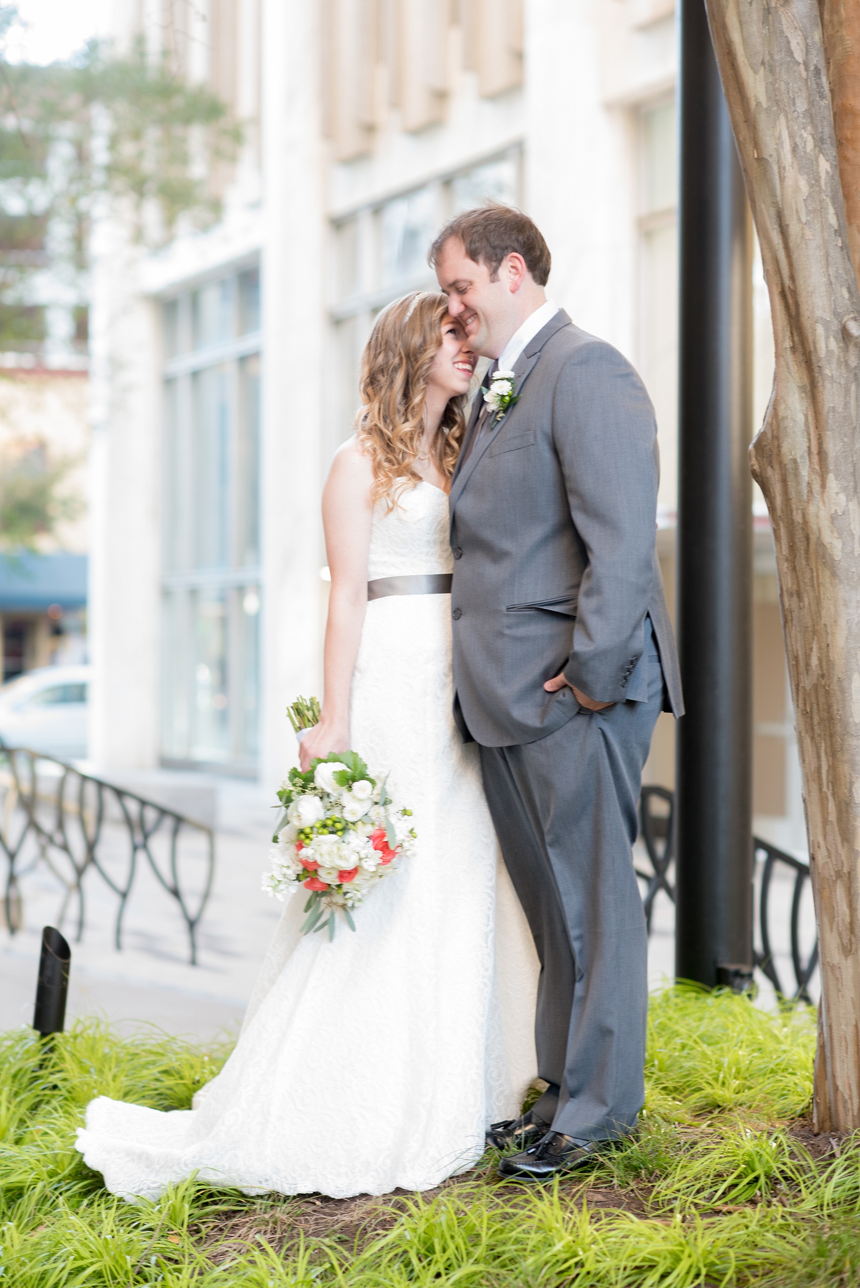 Mikkel Paige Photography photos from a wedding at The Stockroom at 230. A picture of the bride and groom in downtown Raleigh for their first look.