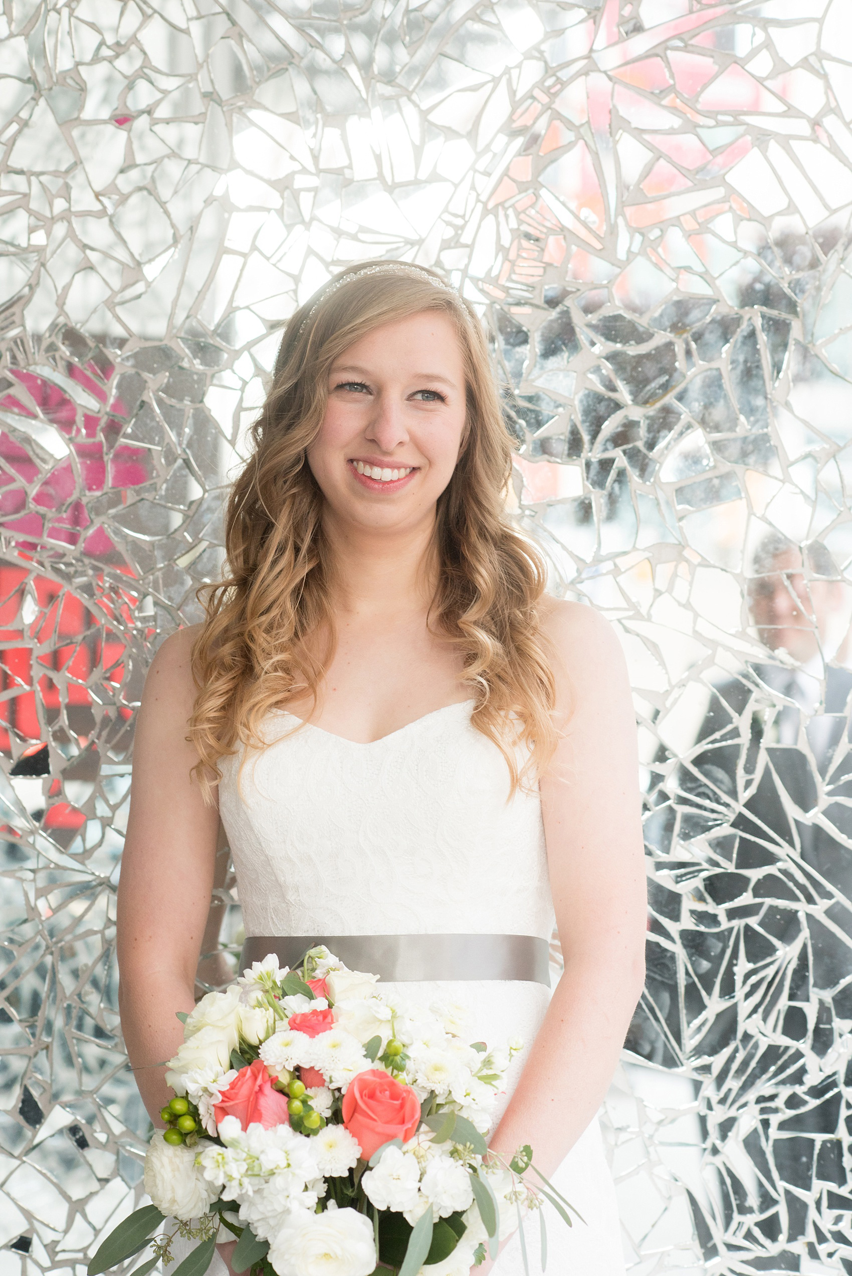 Mikkel Paige Photography photos from a fall wedding at The Stockroom at 230. A unique portrait picture of the bride against mosaic mirrors in downtown Raleigh.