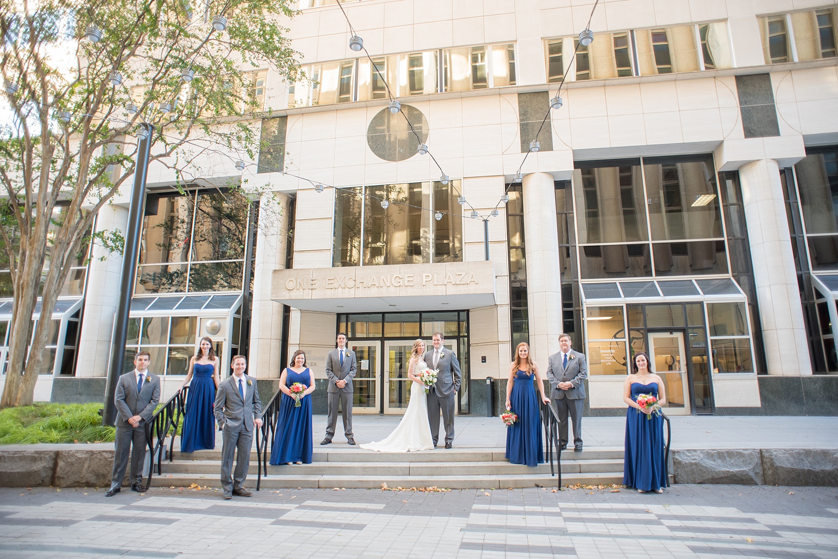 Mikkel Paige Photography photos from a fall wedding at The Stockroom at 230. A unique picture of the bride, groom and their wedding party in downtown Raleigh.