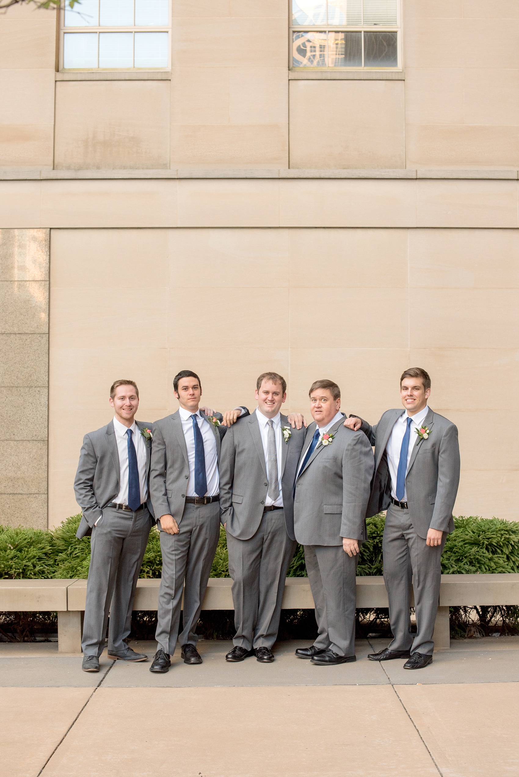 Mikkel Paige Photography photos from a fall wedding at The Stockroom at 230. A unique picture of the groom and his groomsmen in downtown Raleigh.