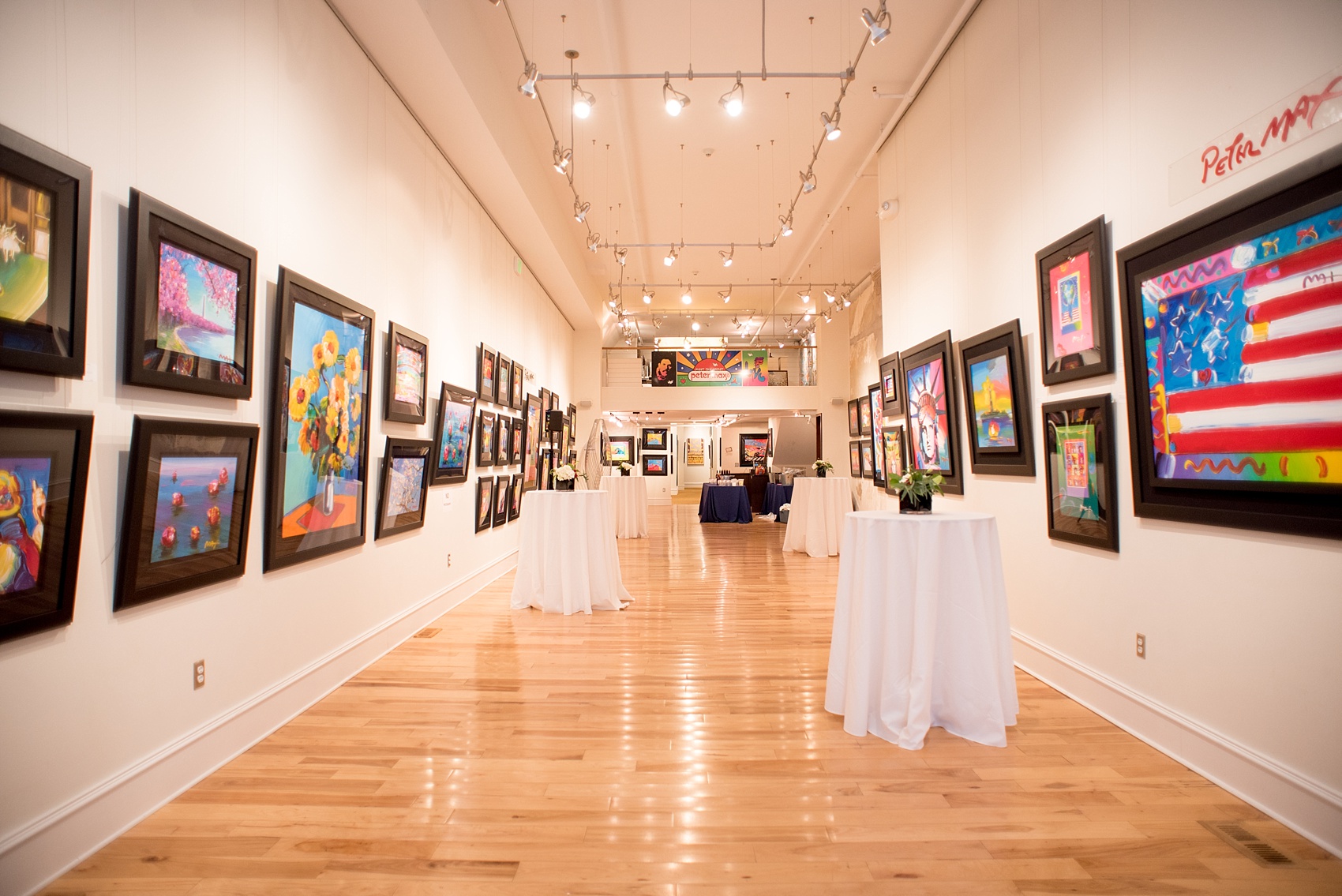 Mikkel Paige Photography photos from The Stockroom at 230 in downtown Raleigh. A picture of the cocktail hour in the Mahler Building with Peter Max art.