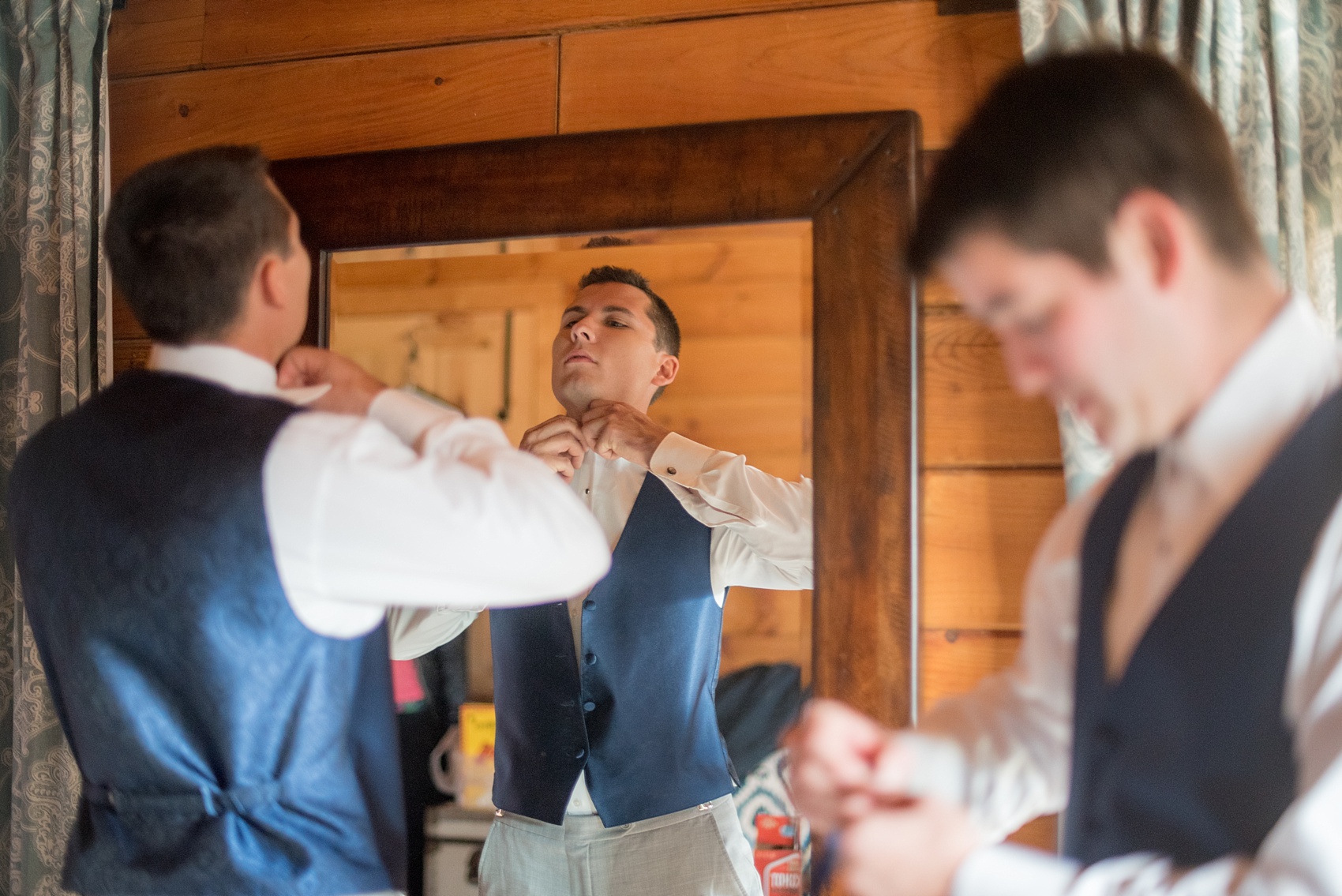 Mikkel Paige Photography photos of a wedding at The Barn at Valahalla in Chapel Hill, NC. The groomsmen prepared with beer and bow ties in their rustic room.
