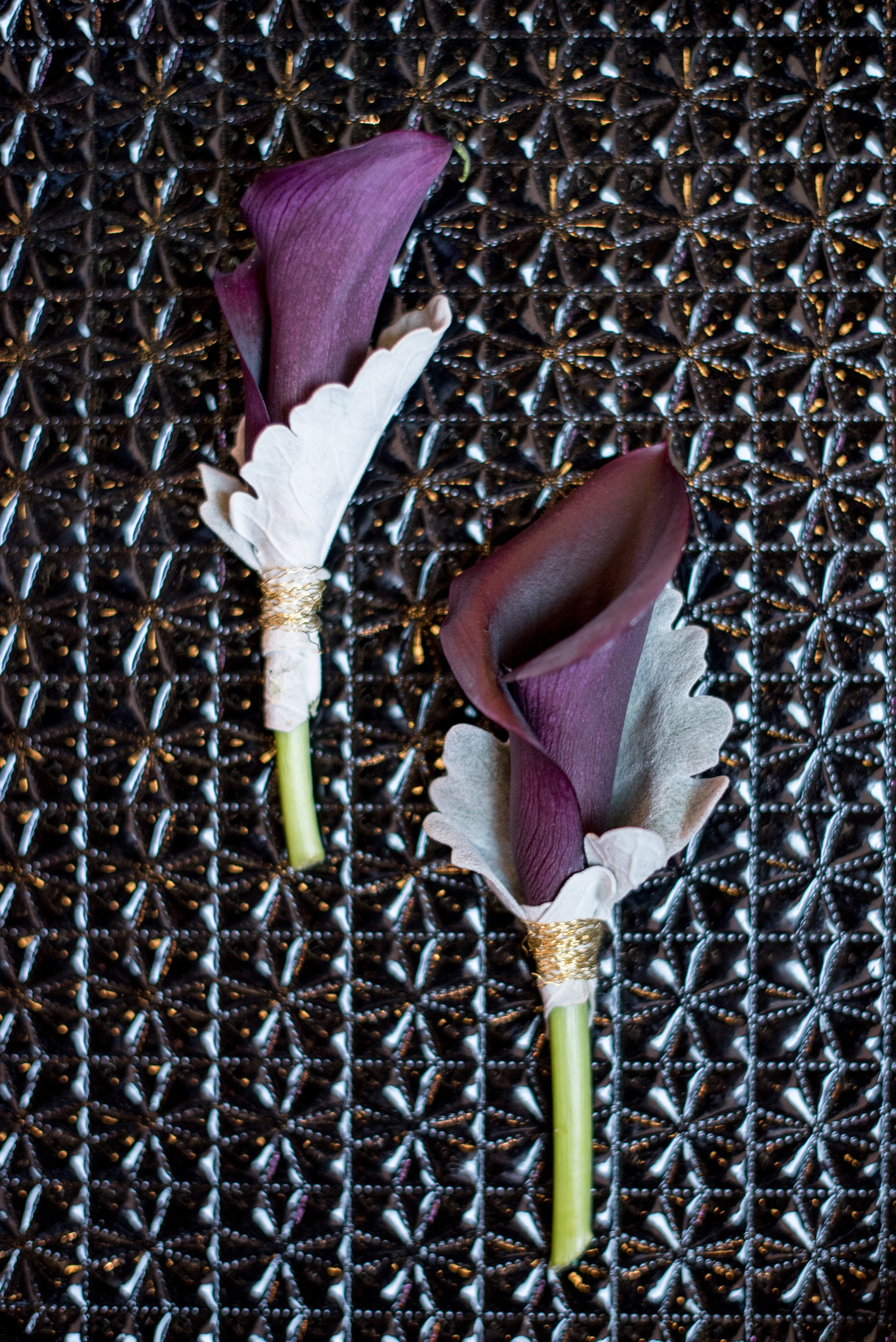 Mikkel Paige Photography pictures of a Raleigh, NC wedding at All Saints Chapel. Modern twist on purple calla lily boutonnieres for two grooms.